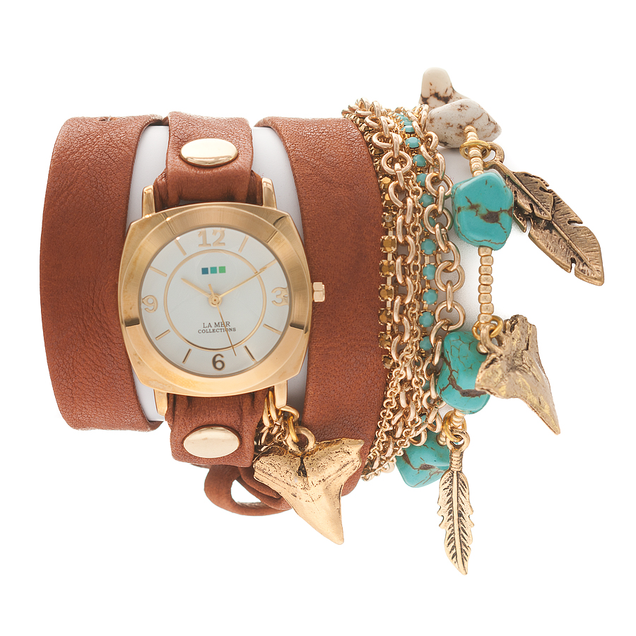Часы наручные женские La Mer Collections Charm Navajo Tobacco. LMMULTI2005LMMULTI2005 Часы наручные женские La Mer Collections Charm Navajo Tobacco. LMMULTI2005LMMULTI2005Часы оснащены японским кварцевым механизмом. Корпус круглой формы выполнен из нержавеющей стали золотистого цвета. Оригинальный кожаный ремешок рыжего цвета отделан металлическими клепками и дополнен связкой цепочек и камнями. Каждая модель женских наручных часов La Mer Collections имеет эксклюзивный дизайн, в основу которого положено необычное сочетание классических циферблатов с удлиненными кожаными ремешками. Оборачиваясь вокруг запястья несколько раз, они образуют эффект кожаного браслета, превращая часы в женственный аксессуар, который великолепно дополнит другие аксессуары и весь образ в целом. Дизайн La Mer Collections отвечает всем последним тенденциям моды и превосходно сочетается с модными сумками, ремнями, обувью и другими элементами гардероба современных девушек. Часы La Mer - это еще и отличный подарок любимой девушке, сестре или подруге на день рождения, восьмое марта или новый год!