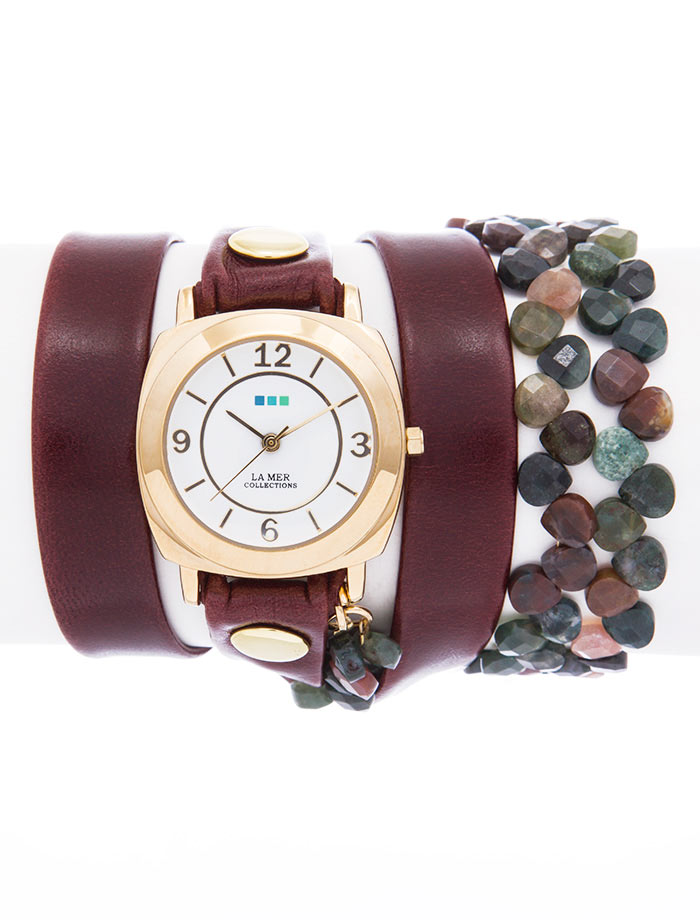 Часы наручные женские La Mer Collections Stones Tesoro -Wine. LMMULTI2014LMMULTI2014 Часы наручные женские La Mer Collections Stones Tesoro -Wine. LMMULTI2014LMMULTI2014Часы оснащены японским кварцевым механизмом. Корпус прямоугольной формы выполнен из нержавеющей стали золотистого цвета. Оригинальный кожаный ремешок бордового цвета отделан металлическими клепками и дополнен декоративными камнями. Каждая модель женских наручных часов La Mer Collections имеет эксклюзивный дизайн, в основу которого положено необычное сочетание классических циферблатов с удлиненными кожаными ремешками. Оборачиваясь вокруг запястья несколько раз, они образуют эффект кожаного браслета, превращая часы в женственный аксессуар, который великолепно дополнит другие аксессуары и весь образ в целом. Дизайн La Mer Collections отвечает всем последним тенденциям моды и превосходно сочетается с модными сумками, ремнями, обувью и другими элементами гардероба современных девушек. Часы La Mer - это еще и отличный подарок любимой девушке, сестре или подруге на день рождения, восьмое марта или новый год!