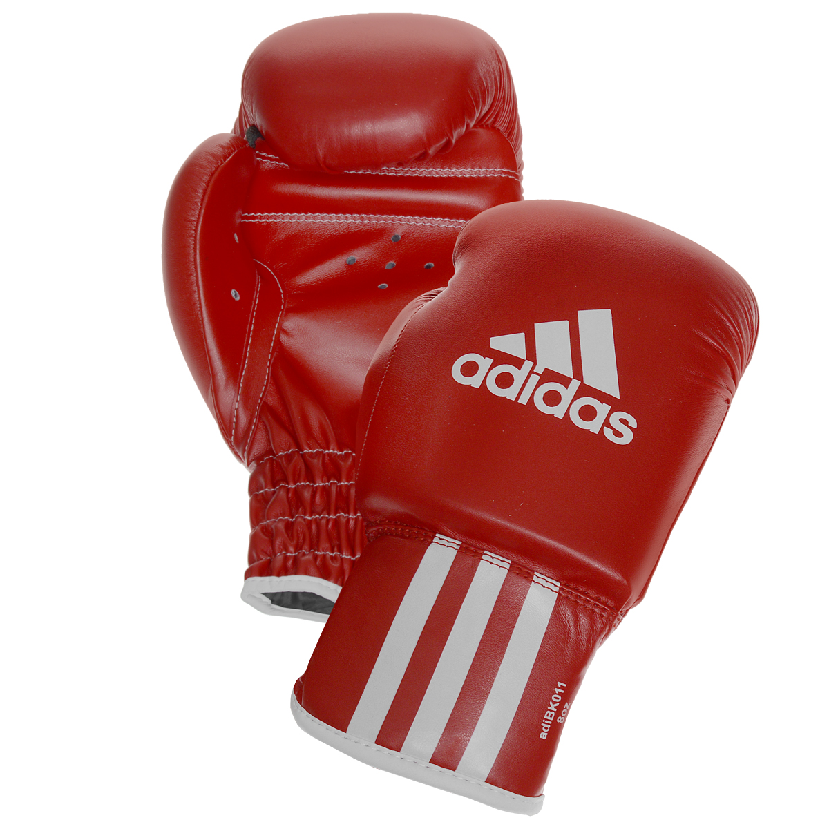 Перчатки боксерские Adidas Rookie-2, цвет: красный. adiBK011. Вес 8 унцийadiBK011 Перчатки боксерские Adidas Rookie-2, цвет: красный. adiBK011. Вес 8 унцийadiBK011Боксерские перчатки Adidas Rookie-2 изготовлены из мягкого полиуретана, который по своим качествам не уступает натуральной коже. Внутренний наполнитель из многослойной пены обеспечивет надежную защиту рук боксера и позволяя безопасно тренироваться в полную силу. Предварительно изогнутый крой перчатки позволяет боксеру держать кулак в правильном положении. Загнутый параллельно кулаку большой палец обеспечивает безопасность при нанесении ударов и защищает большой палец от вывихов и травм. Внутренняя подкладка и вентиляционные отверстия на ладони создают максимальный уровень комфорта для рук, поддерживая оптимальный микроклимат внутри перчаток.