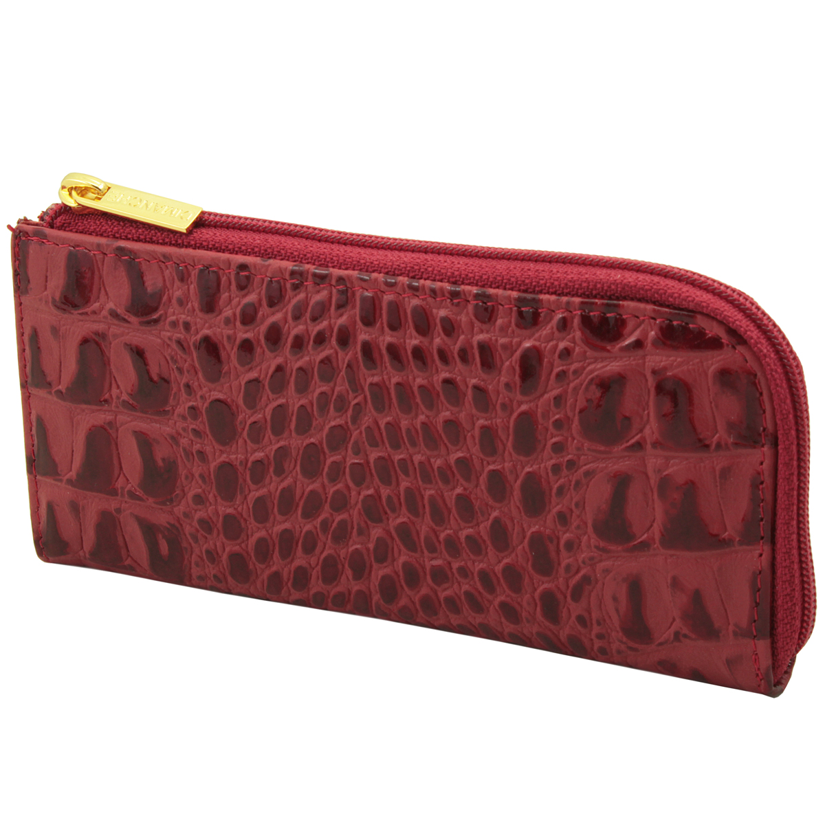 Ключница Dimanche Loricata Rouge, цвет: красный. 209209 Ключница Dimanche Loricata Rouge, цвет: красный. 209209Компактная ключница Loricata Rouge - стильная вещь для хранения ключей. Ключница выполнена из натуральной кожи с декоративным тиснением под крокодила. Состоит из одного отделения, закрывающегося на застежку-молнию. Внутри ключницы на кожаной петле крепится металлическое кольцо для ключей. На внешней стороне расположен дополнительный карман на молнии. Ключница упакована в фирменную картонную коробку.