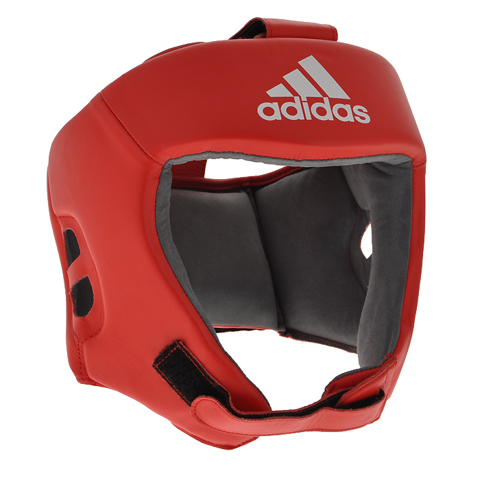 Шлем боксерский Adidas AIBA, цвет: красный. AIBAH1. Размер L (52-56 см)AIBAH1 Шлем боксерский Adidas AIBA, цвет: красный. AIBAH1. Размер L (52-56 см)AIBAH1Боксерский шлем Adidas AIBA разработан и спроектирован для обеспечения максимальной защиты и оптимальной видимости. Шлем сертифицирован Международной ассоциацией бокса (AIBA). Оболочка шлема изготовлена из натуральной кожи, что увеличивает срок эксплуатации шлема. Внутреннее наполнение из пены, изготовленной по технологии Air Cushion, обеспечивает отличную амортизацию ударных нагрузок. Внутренняя подкладка выполнена из высокотехнологичной, искусственной кожи Amara. Шлем имеет легкую конструкцию без защиты скул. Два широких ремня фиксируемых липучкой на теменной части и два ремня на липучке в затылочной части позволяют регулировать размер шлема и обеспечивают плотную и удобную посадку, исключая смещение шлема во время боя. Так же шлем имеет регулируемый ремешок под подбородком.