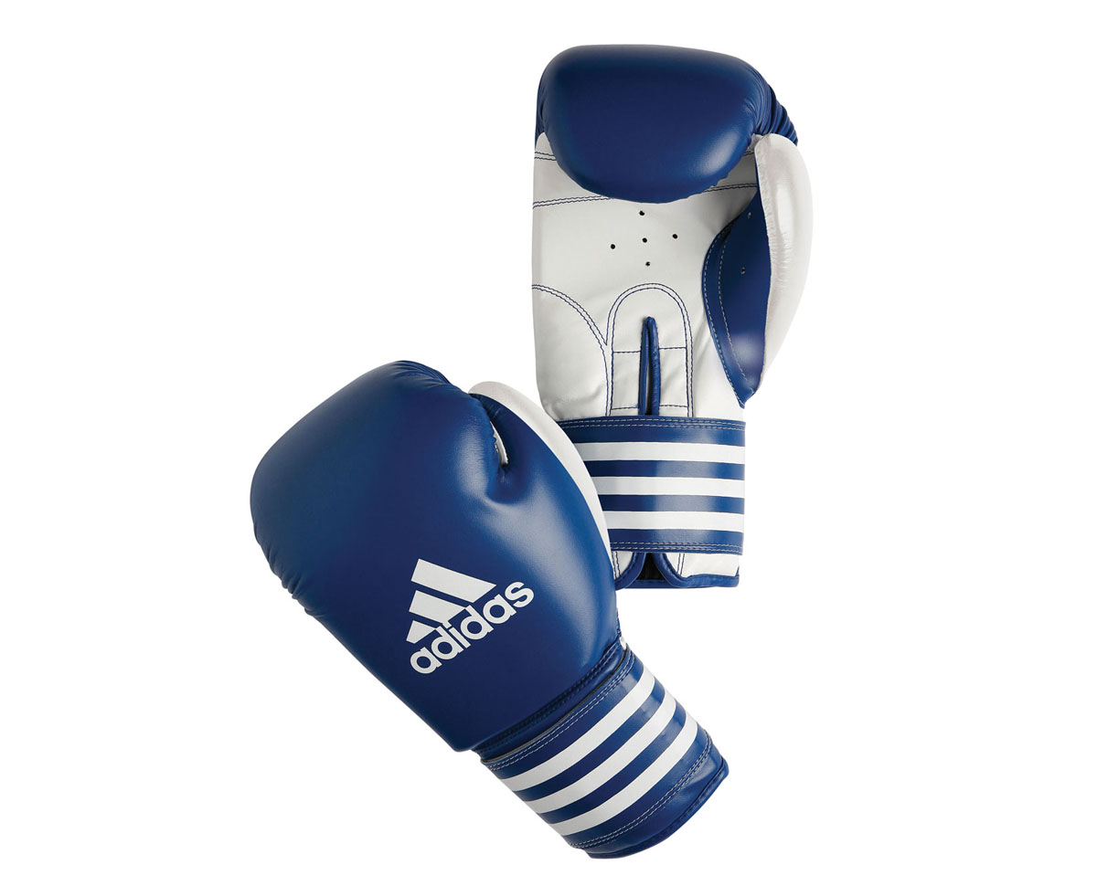 Перчатки боксерские Adidas Ultima Competition, цвет: сине-белый. adiBC02. Вес 10 унцийadiBC02 Перчатки боксерские Adidas Ultima Competition, цвет: сине-белый. adiBC02. Вес 10 унцийadiBC02Боксерские перчатки Adidas Ultima Competition для отработок ударов и комбинаций. Тыльная сторона в перчатках выполнена из прочной, износостойкой, натуральной кожи. Внутренний наполнитель, выполненный из формованной под давлением пены с интегрированной внутренней вставкой из геля, выполненной по технологии I-Protech, покрывает тыльную сторону, создавая надежную защиту рук и давая боксеру возможность безопасно тренироваться в полную силу. Внутренняя подкладка, выполненная из дышащего материала, и вентиляционное отверстие на ладони создают комфортный микроклимат внутри перчаток. Эластичный ремешок с фиксацией на липучке позволяет быстро одеть и снять перчатки.