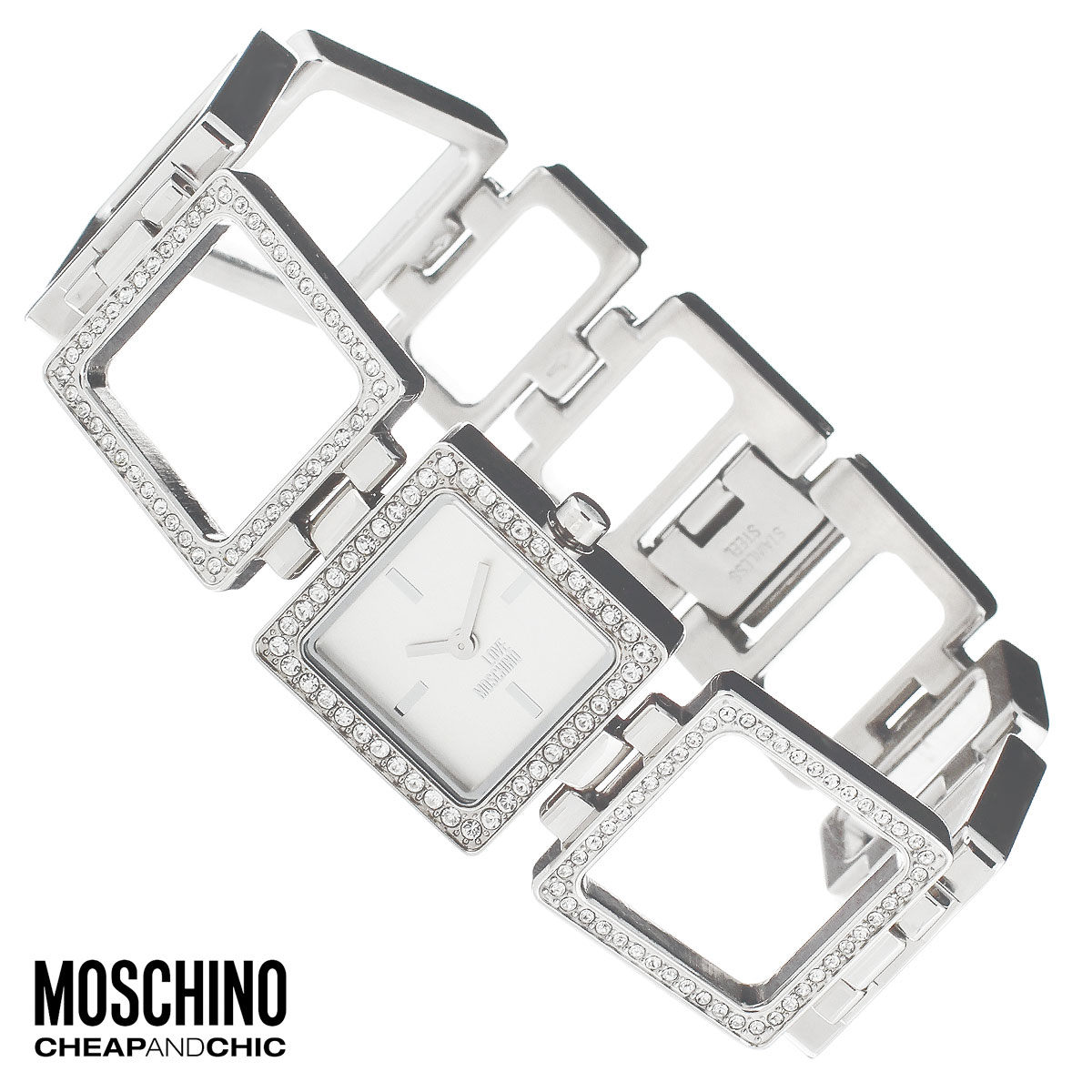 Часы женские наручные Moschino, цвет: серебристый. MW0447MW0447 Часы женские наручные Moschino, цвет: серебристый. MW0447MW0447Наручные часы от известного итальянского бренда Moschino - это не только стильный и функциональный аксессуар, но и современные технологи, сочетающиеся с экстравагантным дизайном и индивидуальностью. Часы Moschino оснащены кварцевым механизмом. Корпус выполнен из высококачественной нержавеющей стали и по контуру циферблата декорирован стразами. Циферблат с отметками оформлен надписью Love Moschino и защищен минеральным стеклом. Часы имеют две стрелки - часовую и минутную. Браслет часов выполнен из нержавеющей стали в виде квадратных звеньев и имеет надежную застежку. Часы упакованы в фирменную металлическую коробку с логотипом бренда. Часы Moschino благодаря своему уникальному дизайну отличаются от часов других марок своеобразными циферблатами, функциональностью, а также набором уникальных технических свойств. Каждой модели присуща легкая экстравагантность, самобытность и, безусловно, великолепный вкус. Характеристики: Размер...