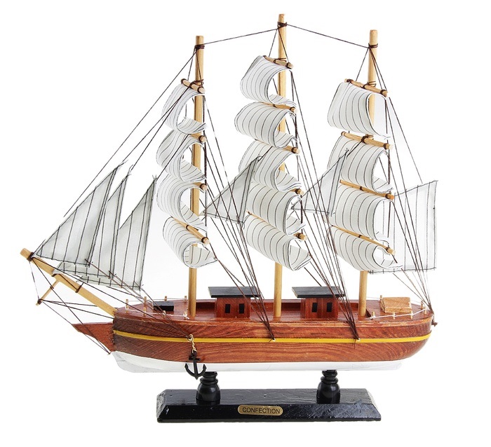 Корабль сувенирный Confection, длина 40 см. 127185127185 Корабль сувенирный Confection, длина 40 см. 127185127185Сувенирный корабль Confection, изготовленный из дерева и текстиля, это великолепный элемент декора рабочей зоны в офисе или кабинете. Корабль с парусами и якорями помещен на деревянную подставку. Время идет, и мы становимся свидетелями развития технического прогресса, новых учений и практик. Но одно не подвластно времени - это любовь человека к морю и кораблям. Сувенирный корабль наполнен историей и силой океанских вод. Данная модель кораблика станет отличным подарком для всех любителей морей, поклонников историй о покорении океанов и неизведанных земель. Модель корабля - подарок со смыслом. Издавна на Руси считалось, что корабли приносят удачу и везение. Поэтому их изображения, фигурки и точные копии всегда присутствовали в помещениях. Удивите себя и своих близких необычным презентом.
