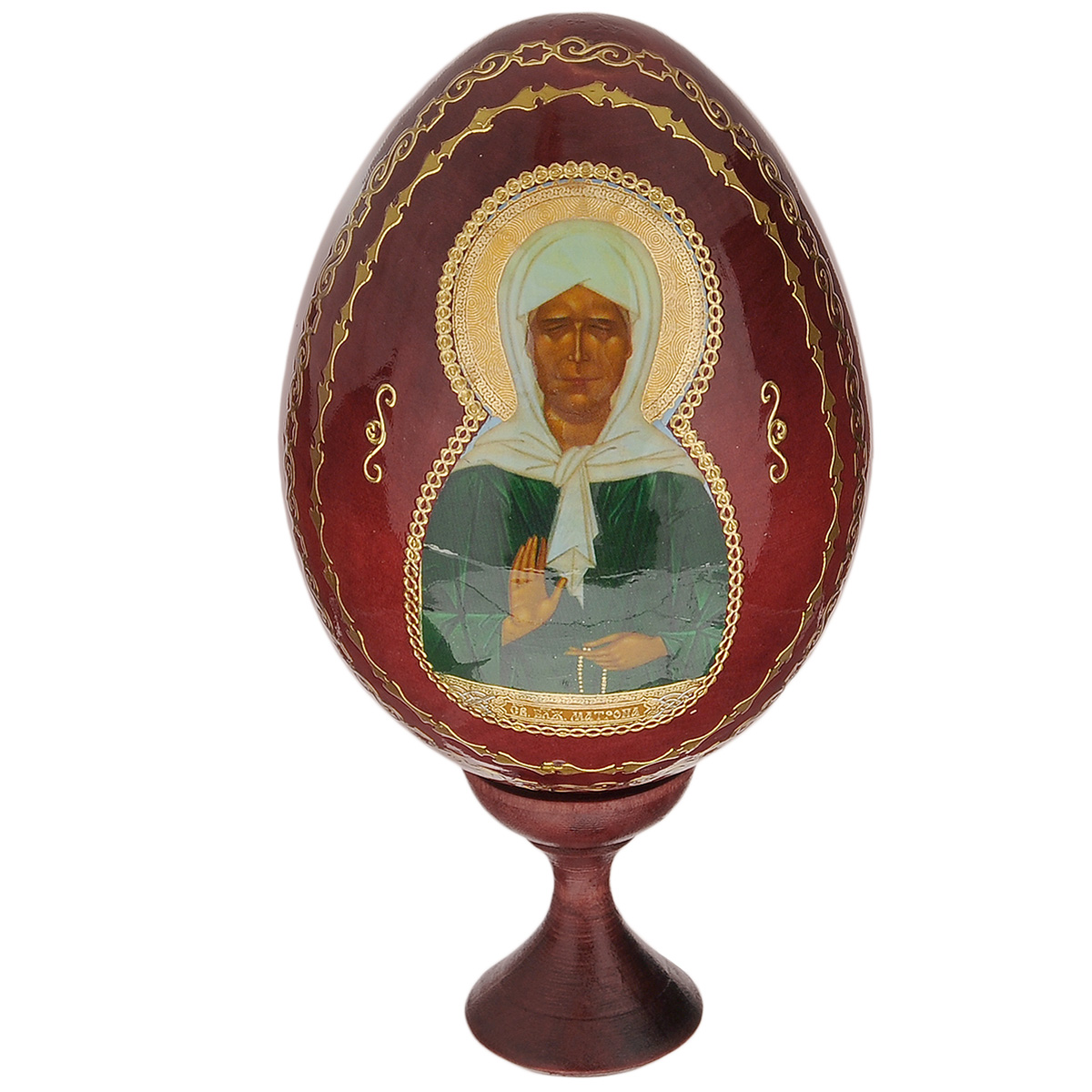 Яйцо декоративное Sima-land Матрона Московская, на подставке, высота 15 см717167 Яйцо декоративное Sima-land Матрона Московская, на подставке, высота 15 см717167Декоративное яйцо Sima-land Матрона Московская изготовлено из дерева с лаковым покрытием. Яйцо оформлено изображением святого лика Матроны Московской и золотыми узорами. Изделие располагается на деревянной подставке. Декоративное яйцо Sima-land Матрона Московская принесет в ваш дом ощущение торжества, душевного уюта и станет идеальным подарком на Пасху. Диаметр яйца: 7,5 см. Высота яйца: 10,5 см. Размер подставки: 3,2 см х 3,2 см х 4,5 см.