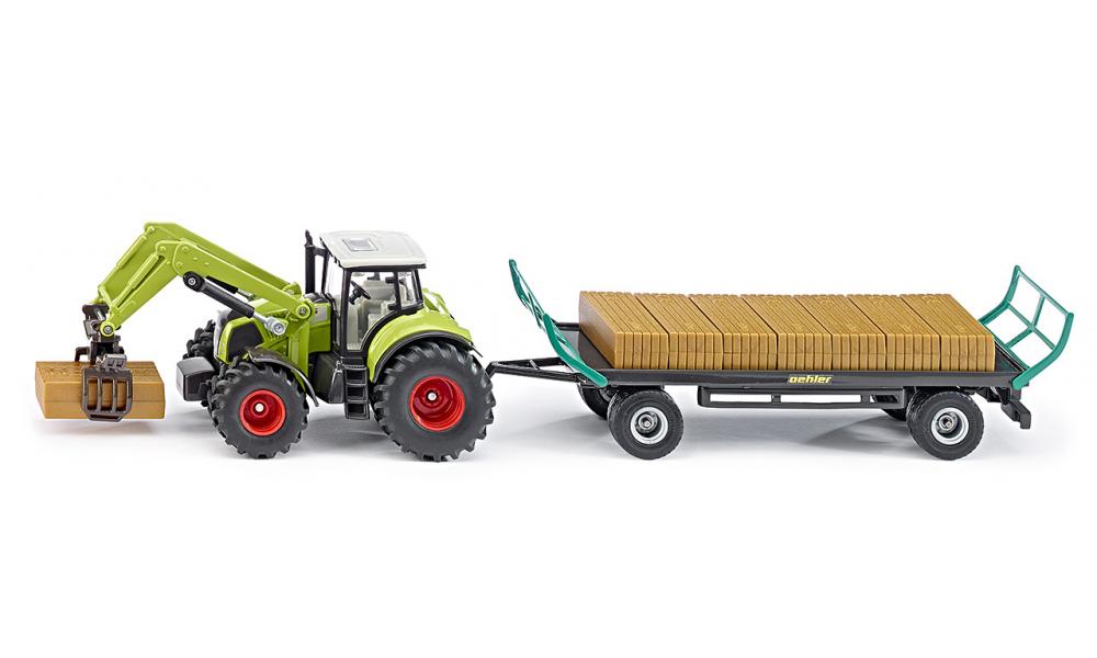 Siku Трактор Claas с прицепом Oehler1946 Siku Трактор Claas с прицепом Oehler1946Трактор Siku Claas с прицепом Oehler выполнен в масштабе 1:50. В набор входят модель трактора и модель прицепа для перевозки грузов. Манипулятор способен захватывать груз. Прицеп оборудован сцепным устройством. В набор также входят имитация грузов, изготовленных из безопасного пластика. Игры с моделями способствуют развитию воображения, мышления, мелкой моторики рук и координации движений.