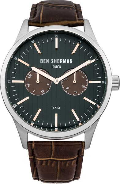 Часы мужские наручные Ben Sherman WB024BR, цвет: стальной, коричневый,зеленый. WB024BRWB024BR Часы мужские наручные Ben Sherman WB024BR, цвет: стальной, коричневый,зеленый. WB024BRWB024BRСтильные мужские часы Ben Sherman выполнены из нержавеющей стали, натуральной кожи и минерального стекла. Изделие оформлено символикой бренда. Часы оснащены кварцевым механизмом с двумя стрелками, полированным корпусом, устойчивым к царапинам минеральным стеклом, степенью влагозащиты 5atm, двумя дополнительными циферблатами с индикаторами даты. Изделие дополнено ремешком из натуральной кожи с тиснением под рептилию и практичной пряжкой, позволяющей максимально комфортно и быстро снимать и одевать часы. Часы поставляются в фирменной упаковке. Часы Ben Sherman подчеркнут мужской характер и отменное чувство стиля их обладателя.