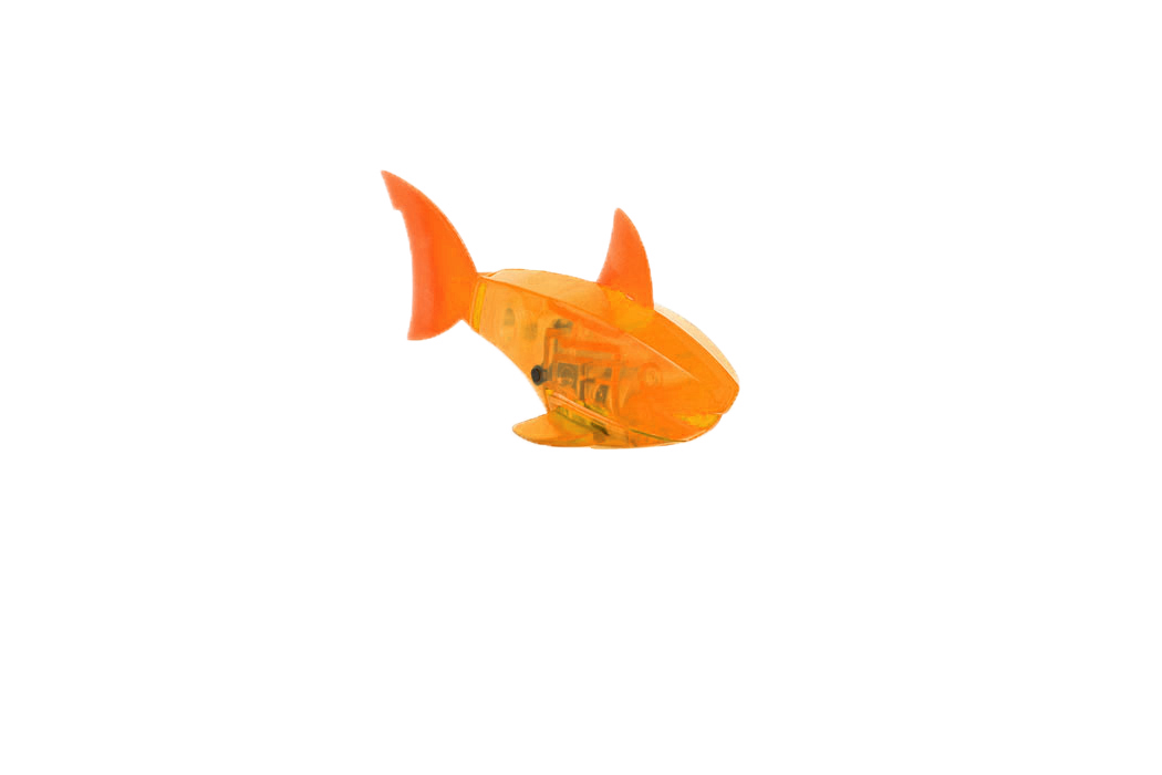 Микро-робот Hexbug Aquabot Shark, цвет: оранжевый460-3028_5 Микро-робот Hexbug Aquabot Shark, цвет: оранжевый460-3028_5Уникальный микро-робот Hexbug Aquabot Shark изготовлен из безопасного пластика в виде акулы. Теперь микро-роботы осваивают и водные глубины! Hexbug Aquabot Shark плавает как настоящая акула и непредсказуем в направлении движения. Опустите его в воду и он оживет! Если микро-робот замер, то достаточно просто всколыхнуть воду и он снова поплывет. Вне воды он автоматически выключается. Для работы игрушки необходимы 2 батарейки типа LR44 (товар комплектуется демонстрационными).