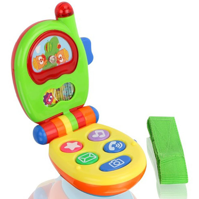 Музыкальная игрушка Малышарики Музыкальный телефонMSH0303-005 Музыкальная игрушка Малышарики Музыкальный телефонMSH0303-005Музыкальная игрушка Малышарики Музыкальная установка - это не только веселая, но и полезная игрушка для малыша. Она не позволит ему скучать и научит новому. С такой игрушкой малыш сможет познакомиться с миром звуков, а благодаря ярким световым и звуковым эффектам, игра будет еще интереснее. Игрушка выполнена из безопасного прочного пластика ярких цветов в виде складного мобильного телефона. На корпусе телефона расположены 5 кнопок, издающих звуки телефонного звонка, щелчок фотоаппарата или забавную мелодию при нажатии. На экране телефона находится картинка с малышами-Смешариками с подвижным элементом, который малыш сможет передвигать, закрывая одну или другую половину картинки. Выше располагается экран с картинкой, которая крутится при нажатии на кнопку справа. Во время игры антенна телефона будет мигать яркими огоньками. Игры с такой игрушкой развивают мелкую моторику, концентрацию внимания, творческие способности, слуховое восприятие и координацию движений малыша. ...