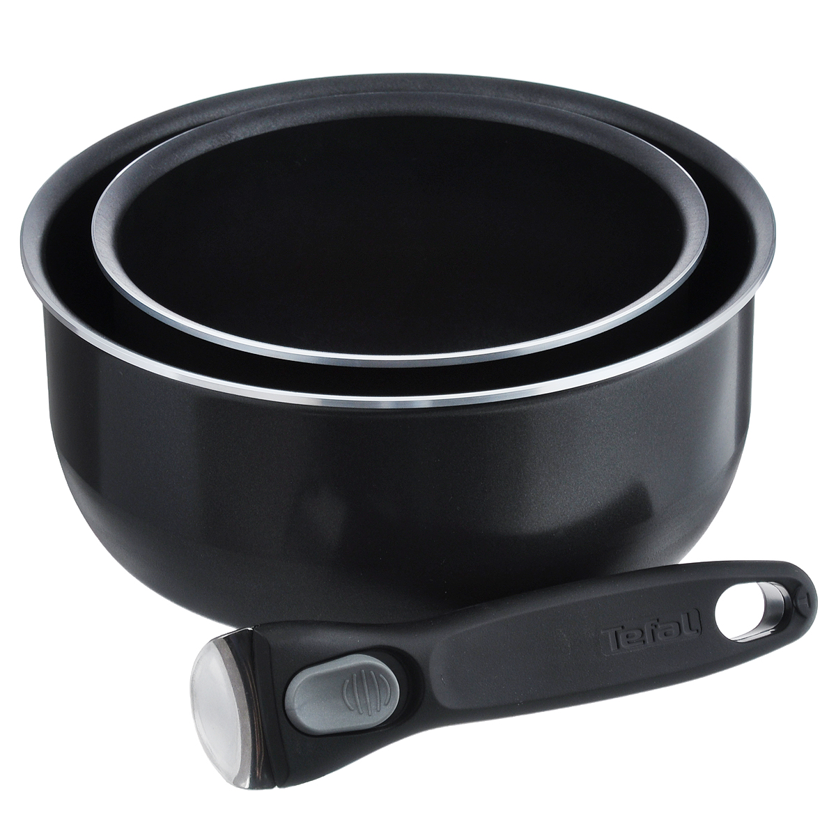 Набор посуды Tefal Ingenio, цвет: черный, 3 предмета. 91000158929100015892 Набор посуды Tefal Ingenio, цвет: черный, 3 предмета. 91000158929100015892Набор Tefal Ingenio состоит из двух ковшей, выполненных из алюминия и покрытых эмалью, и одной съемной ручки. Элегантную и практичную ручку Ingenio, выполненную из бакелита со вставками из нержавеющей стали, вы сможете отсоединить без малейшего труда, просто надавив одной рукой на две боковые кнопки. Благодаря съемной ручке посуда легко и просто вкладывается друг в друга по принципу матрешки и хранится, занимая минимум места. А готовое блюдо можно не перекладывать в другую посуду, поскольку данный набор подходит и для сервировки стола. Устойчивое к деформации дно Optimal содержит слой, в состав которого входят хлопья слюды, обеспечивающие оптимальное распределение тепла и равномерное приготовление пищи. Можно использовать на всех видах плит, кроме индукционных. Можно мыть в посудомоечной машине. Можно использовать посуду в духовке с максимальной температурой нагрева 250°C (без ручки), ставить ее в холодильник или мыть в посудомоечной машине. ...