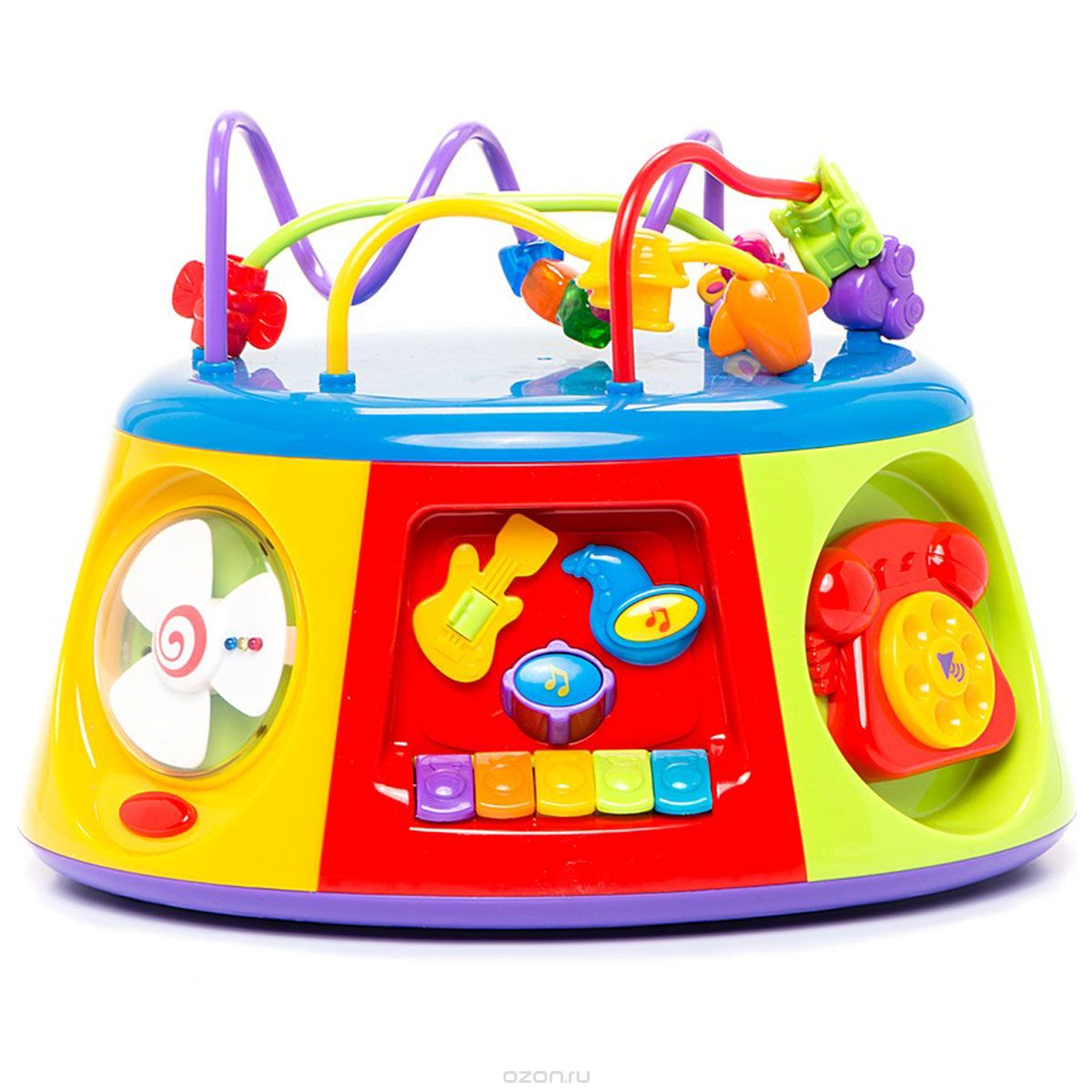 Kiddieland Развивающий центр Активный коробKID 051193 Kiddieland Развивающий центр Активный коробKID 051193Мультицентр Kiddieland Активный короб - оригинальная музыкальная развивающая многофункциональная игрушка, настоящий игровой центр, озвученный на русском языке. Изучая 7 сторон мультицентра, ребенок получит базовые знания о временах года, познакомится с пятью геометрическими фигурами и узнает их особенности, поймет, как звучат разные музыкальные инструменты, научится определять время по стрелочным часам, сможет позвонить по своему первому телефону и сочинить свою первую мелодию! Верхний модуль выполнен в виде лабиринта с яркими бусинами. Игрушка развивает мелкую моторику, мышление, зрительное и звуковое восприятие. Рекомендуемый возраст: от 12 месяцев. Питание: 3 батарейки типа АА (входят в комплект).