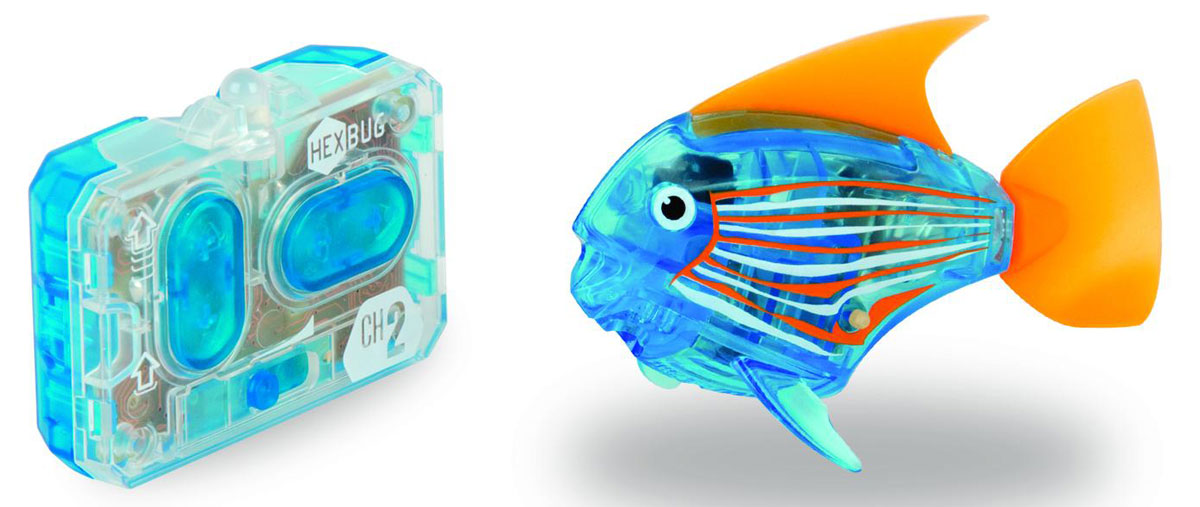 Hexbug Микро-робот на радиоуправлении Рыба-ангел цвет синий460-4086 Hexbug Микро-робот на радиоуправлении Рыба-ангел цвет синий460-4086Hexbug Aquabot 3.0 RC - это обновленная версия роборыбки, управляемая при помощи пульта ДУ. Кроме того, управляемая рыбка-ангел получила яркий и привлекательный окрас плавничков и хвостика, стильный декор и умные, словно настоящие, глазки. Наделив рыбку пультом ДУ, разработчики не лишили ее самостоятельности. Если вы не хотите управлять рыбкой, то просто пустите робо-рыбку в аквариум и она будет плавать сама. Не утратила прирученная рыбка и первоначальных свойств: как и раньше аквабот просыпается от стука по стенкам аквариума и светится в темноте.