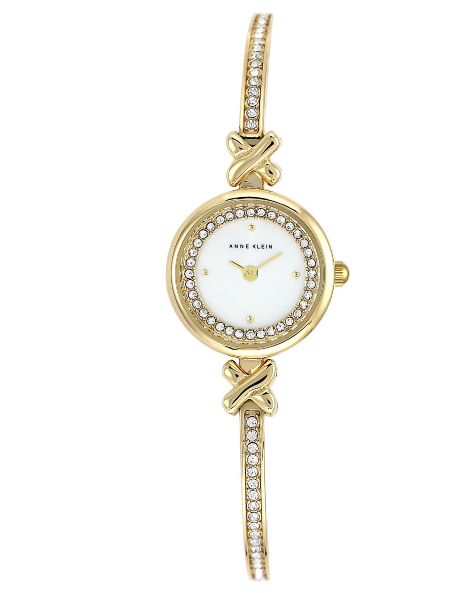 Часы наручные женские Anne Klein, цвет: белый, золотой. 1688MPGB1688MPGB Часы наручные женские Anne Klein, цвет: белый, золотой. 1688MPGB1688MPGBЭлегантные женские часы Anne Klein выполнены из металлического сплава и минерального стекла. Циферблат изделия дополнен вставкой из перламутра, символикой бренда и стразами. Браслет часов оформлен стразами. Корпус часов оснащен кварцевым механизмом, имеет степень влагозащиты равную 3 atm, а также дополнен устойчивым к царапинам минеральным стеклом. Браслет оснащен складным замком, который позволит с легкостью снимать и надевать часы, а также регулировать длину изделия. Часы поставляются в фирменной упаковке. Часы Anne Klein подчеркнут изящность женской руки и отменное чувство стиля у их обладательницы.
