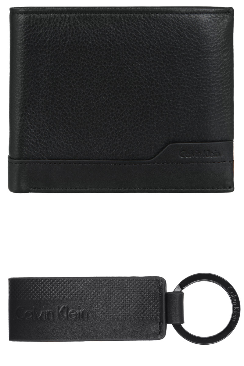 Подарочный набор мужской Calvin Klein Jeans: кошелек, ключница, цвет: черный. K50K500951K50K500951 Подарочный набор мужской Calvin Klein Jeans: кошелек, ключница, цвет: черный. K50K500951K50K500951Подарочный набор мужской Calvin Klein Jeans включает в себя кошелек и ключницу. Все составляющие набора оформлены символикой бренда. Кошелек выполнен из натуральной кожи. Изделие раскладывается пополам и включает в себя: два отделения для купюр, отделение для монет на кнопке, пять накладных карманов, девять кармашков для кредитных карт. Ключница оснащена кольцом для ключей и кожаным брелоком с символикой бренда. Подарочный набор поставляется в фирменной упаковке. Подарочный набор Calvin Klein Jeans станет отличным подарком человеку, ценящему практичные и стильные вещи, а качество его исполнения представит такой подарок в самом выгодном свете.