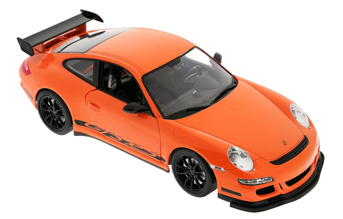 Welly Радиоуправляемая модель Porsche 911 GT3 RS82003 Welly Радиоуправляемая модель Porsche 911 GT3 RS82003Радиоуправляемая модель Welly Porsche 911 GT3 RS обязательно привлечет внимание взрослого и ребенка и понравится любому, кто увлекается автомобилями. Маневренная и реалистичная уменьшенная копия Porsche 911 GT3 RS выполнена в точной детализации с настоящим автомобилем в масштабе 1/12. Управление машинкой происходит с помощью пульта. Машинка двигается вперед и назад, поворачивает направо и налево. При движении загораются передние и задние фары. При помощи пульта у машинки открываются двери. Радиус действия пульта - 30 метров. Колеса игрушки прорезинены и обеспечивают плавный ход, машинка не портит напольное покрытие. Радиоуправляемые игрушки способствуют развитию координации движений, моторики и ловкости. Ваш ребенок часами будет играть с моделью, придумывая различные истории и устраивая соревнования. Порадуйте его таким замечательным подарком! Для работы машинки необходимо докупить 6 батареек напряжением 1,5V типа АА. Для работы пульта требуется 4...