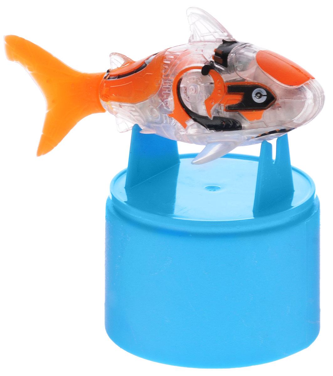 Robofish Игрушка для ванной Тропическая РобоРыбка Акула2549-2_оранжевый Robofish Игрушка для ванной Тропическая РобоРыбка Акула2549-2_оранжевыйИгрушка для ванны Robofish Тропическая РобоРыбка. Акула понравится вашему малышу и превратит купание в веселую игру. Она выполнена из безопасного пластика с элементами металла в виде маленькой красочной рыбки. При погружении в ванну, аквариум или другую емкость с водой РобоРыбка начинает плавать, опускаясь ко дну и поднимаясь к поверхности воды. Игрушка прекрасно имитирует повадки настоящей акулы. Траектория ее движения зависит от наклона хвоста. Внутри рыбки находится специальный груз, регулирующий глубину ее погружения. Если рыбка плавает на дне, не всплывая, - уберите груз; если на поверхности - добавьте его. Набор включает подставку, на которой можно разместить рыбку, пока вы с ней не играете. Порадуйте вашего ребенка таким замечательным подарком! Игрушка работает от 2 батареек напряжением 1,5V типа LR44 (2 установлены в игрушку и 2 запасные).