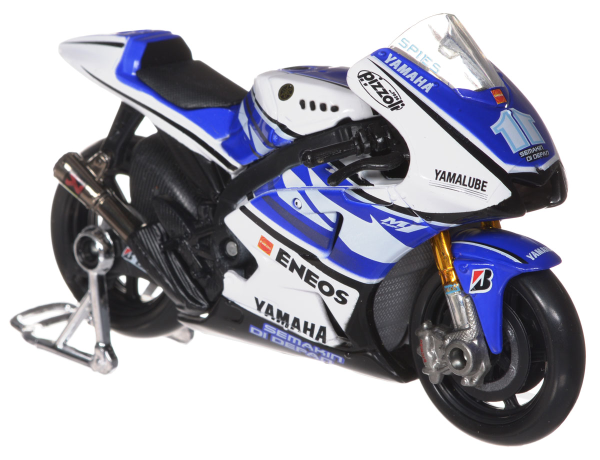 Maisto Модель мотоцикла Yamaha Factory Racing31583 Maisto Модель мотоцикла Yamaha Factory Racing31583Коллекционная модель мотоцикла Yamaha Factory Racing порадует и ребенка и взрослого коллекционера. Высококачественная коллекционная модель мотоцикла в масштабе 1:18. У мотоцикла литой металлический корпус с высокой детализацией двигателя, дисков, протекторов, выхлопной системы. У модели поворачивается руль и работает амортизатор заднего колеса. Игрушка изготовлена из металла и пластика. Мотоцикл в точности повторяет модель оригинальной техники, подробная детализация в полной мере позволит вам оценить высокую точность копии этого мотоцикла! Коллекционная модель мотоцикла Yamaha Factory Racing обязательно понравится вашему ребенку и станет отличным дополнением любой коллекции.