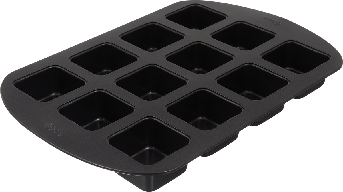 Форма для выпечки Wilton Пирожные, с антипригарным покрытием, 12 ячеекWLT-2105-0454 Форма для выпечки Wilton Пирожные, с антипригарным покрытием, 12 ячеекWLT-2105-0454Форма для выпечки праздничного угощения Wilton Пирожные изготовлена из высококачественной стали с антипригарным покрытием. С таким покрытием пища не пригорает и не прилипает к стенкам. Готовить можно с минимальным количеством подсолнечного масла. Форма содержит 12 квадратных ячеек. Простая в уходе и долговечная в использовании форма Пирожные будет верной помощницей в создании ваших кулинарных шедевров. Подходит для использования в духовом шкафу. Размер формы: 40 х 27,5 х 4 см. Размер ячейки: 6,5 х 6,5 х 4 см. Количество ячеек: 12 шт.