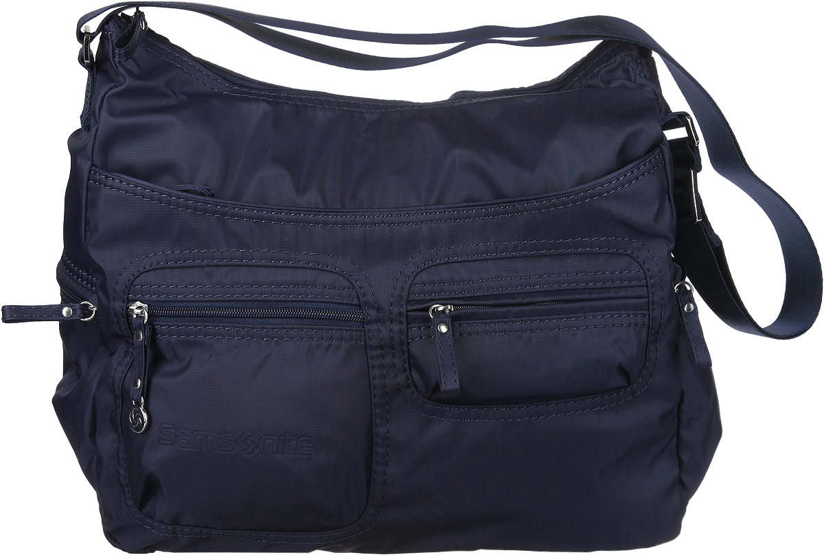 Сумка женская Samsonite, цвет: синий. 5H3-010185H3-01018 Сумка женская Samsonite, цвет: синий. 5H3-010185H3-01018Стильная женская сумка Samsonite выполнена из полиамида, оформлена металлической фурнитурой и символикой бренда. Изделие содержит одно отделение, которое закрывается на застежку-молнию. Внутри сумки расположены два накладных кармашка для мелочей, карабин для ключей и врезной карман на застежке-молнии. Задняя сторона сумки дополнена накладным карманом на застежке-молнии. На лицевой стороне сумки расположены два объемных кармашка, каждый из которых закрывается на молнию, и вместительный накладной карман на застежке-молнии. По бокам изделия расположены два врезных кармана, закрывающиеся на молнии. Изделие оснащено практичным плечевым ремнем регулируемой длины. Практичный аксессуар позволит вам завершить образ и быть неотразимой.
