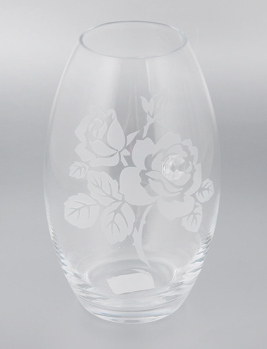 Ваза Deco Glass Роза, высота 23,5 смD04021/0232/X2475AL Ваза Deco Glass Роза, высота 23,5 смD04021/0232/X2475ALВаза Deco Glass Роза ручной работы, выполненная из прозрачного стекла, оформлена гравировкой в виде цветов и декорирована изящным кристаллом. Вазу можно использовать как декоративный элемент, поставить в нее букет прекрасных цветов или декоративных веточек. Нарядная и утонченная ваза Deco Glass Роза станет великолепным подарком на любой праздник. Диаметр вазы (по верхнему краю): 8,5 см. Высота вазы: 23,5 см.