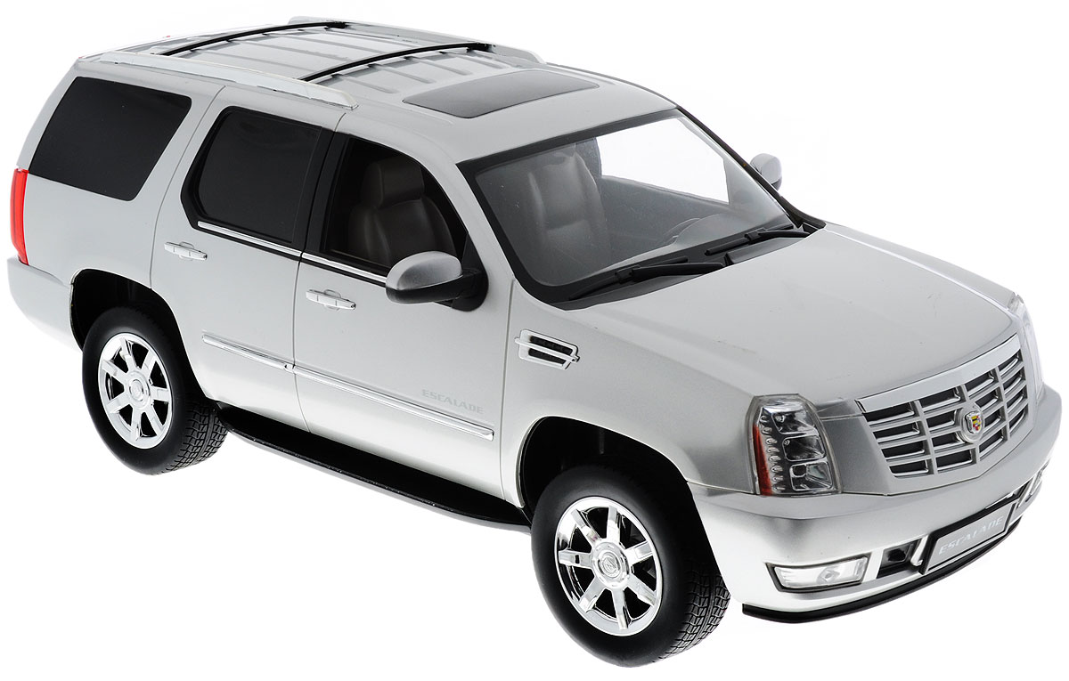 Rastar Радиоуправляемая модель Cadillac Escalade цвет серебристый28400_серебристый Rastar Радиоуправляемая модель Cadillac Escalade цвет серебристый28400_серебристыйРадиоуправляемая модель Rastar Cadillac Escalade станет первым внедорожником вашего малыша. Это точная копия настоящего авто в масштабе 1:14. Юные гонщики оценят эту машину за прекрасные технические характеристики и полную свободу передвижений в любую сторону. Моделью легко управлять и любая гонка принесет удовольствие. Управление машинкой происходит с помощью удобного пульта. Автомобиль двигается вперед и назад, поворачивает направо, налево и останавливается. Имеются световые эффекты. Автомобиль изготовлен из пластика с металлическими элементами. Колеса игрушки прорезинены и обеспечивают плавный ход, машинка не портит напольное покрытие. Пульт управления работает на частоте 40 MHz. Радиоуправляемые игрушки способствуют развитию координации движений, моторики и ловкости. Ваш ребенок часами будет играть с моделью, придумывая различные истории и устраивая соревнования. Машина работает от пяти батареек типа АА (не входят в комплект). Для работы пульта управления...