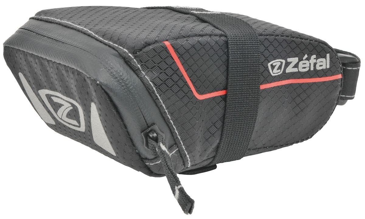 Подседельная сумка Zefal Z Light Pack S7040 Подседельная сумка Zefal Z Light Pack S7040Подседельная сумка для велосипеда Zefal Z Light Pack S изготовлена из высококачественного текстиля (полистер). Прорезиненная молния защиты от попадания влаги внутрь. Легкая и быстрая установка на подседельный штырь и рамки седла. Zefal – старейший французский производитель велосипедных аксессуаров премиального качества, основанный в 1880 году, является номером один на французском рынке велосипедных аксессуаров. Подседельная сумка Zefal Z Light Pack S, размер S, цвет черный ОСОБЕННОСТИ: - Сумка изготовлена из полистера - Водонепроницаемая молния - Крепление на душки седла - Объем 0,5 л (16 oz) - Габариты сумки 140 х 70 х 65 мм - Вес 40гр