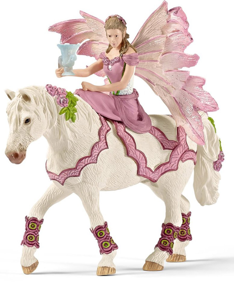 Schleich Фигурка Эльфийка Фея на лошади70519 Schleich Фигурка Эльфийка Фея на лошади70519Фигурка Schleich Эльфийка Фея разнообразит сюжетно-ролевые фантастические игры вашего ребенка и станет прекрасным пополнением коллекции эльфов. Прекрасно выполненные фигурки эльфов отличаются высочайшим качеством игрушек ручной работы. Каждая фигурка разработана с учетом исследований в области педагогики и производится как настоящее произведение для маленьких детских ручек. Сюжетно-ролевые игры с фигурками развивают фантазию и воображение ребенка. Фея из волшебной страны эльфов Bayala отправляется на бал. Для этого она сшила себе превосходное платье и села на свою любимую лошадку. За спиной у феи большие крылышки, которые блестят на солнышке и позволяют ей быстро перелетать с одного места на другое. Фигурка надежно держится на лошадке благодаря встроенному магниту.