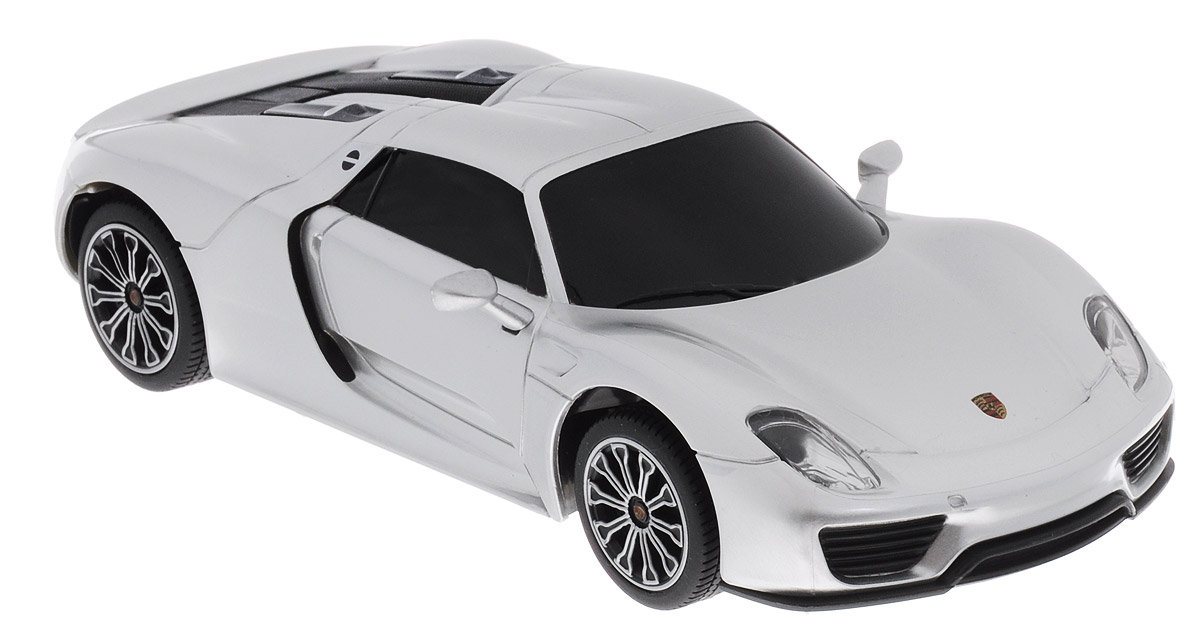 Rastar Радиоуправляемая модель Porsche 918 Spyder цвет серебристый71400 Rastar Радиоуправляемая модель Porsche 918 Spyder цвет серебристый71400Радиоуправляемая модель Rastar Porsche 918 Spyder является точной копией настоящего автомобиля в масштабе 1/24. Управление автомобилем происходит с помощью удобного пульта. Машина двигается вперед и назад, поворачивает направо и налево. Колеса игрушки прорезинены и обеспечивают плавный ход, машинка не портит напольное покрытие. Пульт управления работает на частоте 27 MHz. Такая модель автомобиля станет отличным подарком не только автолюбителю, но и человеку, ценящему оригинальность и изысканность, а качество исполнения представит такой подарок в самом лучшем свете. Радиоуправляемые игрушки способствуют развитию координации движений, моторики и ловкости. Машина работает от 3 батареек типа АА (не входят в комплект). Пульт управления работает от 2 батареек типа АА (не входят в комплект).