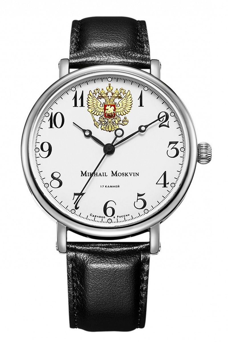 Часы наручные мужские Mikhail Moskvin, цвет: серебристый. 1050A1L51050A1L5 Часы наручные мужские Mikhail Moskvin, цвет: серебристый. 1050A1L51050A1L5Классическая модель часов, производства угличских часовщиков, сочетающая в себе элегантность и надежность. Тонкий ободок корпуса диаметром 43 мм дополнен крупной заводной головкой в форме сферы. Покрытие выполнено по современным технологиям напылением ионами стали. Тонкие уши, фиксирующие черный ремень из натуральной кожи, дополнены с боков винтами. Черные арабские цифры на белом поле циферблата придают часам стильность. Золотистый герб – символ России – отлично гармонирует с черными стрелками. Механический механизм ручного завода отвечает за работу часовой, минутной и секундной стрелок. Минеральное стекло с сапфировым напылением устойчиво к царапинам. Ремень комплектуется стальной застежкой, гарантирующей комфорт и надежность.