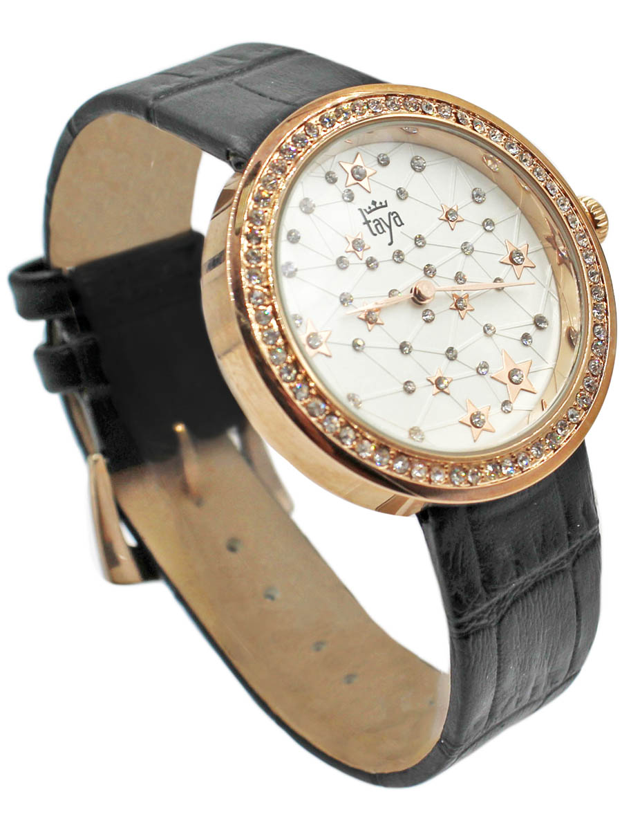Наручные часы Taya, цвет: золотистый, черный. T-W-0039-WATCH-GL.BLACKT-W-0039-WATCH-GL.BLACK Наручные часы Taya, цвет: золотистый, черный. T-W-0039-WATCH-GL.BLACKT-W-0039-WATCH-GL.BLACKСтильные часы с серебряным циферблатом со стразами по окружности. Внутри имитация звездного неба с множеством созвездий. Часы наручные электронно-механические кварцевые, аксессуарные, с механической индикацией. Часовой механизм MORIOKA TOKEI inc., Сингапур с питанием от сменного кварцевого элемента питания типа LR626.