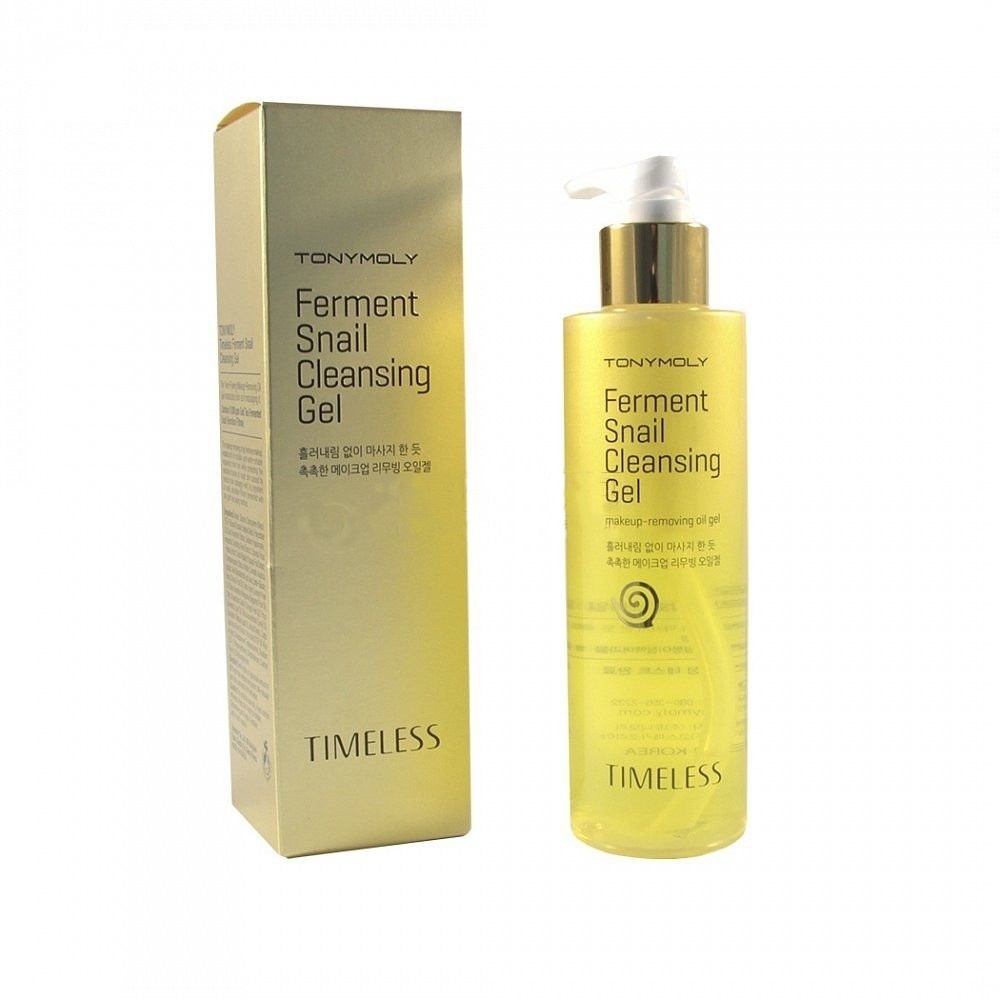 TonyMoly Очищающий гель для лица Timeless ferment snail cleansing gel, 200 грSS01010700 TonyMoly Очищающий гель для лица Timeless ferment snail cleansing gel, 200 грSS01010700Гель улиточный из линии премиум класса от Tonymoly мягко и эффективно очищает кожу от всех видов загрязнений, накапливающихся в течение дня. Маслянистая текстура геля также сравнима по свойствам с гидрофильным маслом. Гель удаляет даже самый стойкий макияж, в том числе тональные основы, бб/сс-крем и пр. После использования геля кожа чистая и ухоженная, светится лоском и свежестью. Средство предотвращает воспаления и раздражения, а также неприятные черные точки и закупоренные поры. Основа масла - экстракт улитки. Это слизь, которую производит улитка для восстановления поврежденных участков своего тела, именно поэтому это вещество обладает очень мощным восстанавливающим и омолаживающим действием, причем кожа человека очень хорошо его воспринимает, принимая за свое. Муцин улитки действует по нескольким направлениям: -увлажняет -питает -обеззараживает -омолаживает -заживляет -тонизирует -разглаживает кожу -наполняет жизненной силой -придает бархатистость