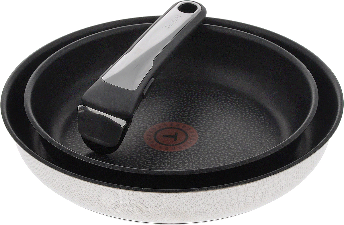 Набор сковородок Tefal Ingenio, с антипригарным покрытием, со съемной ручкой, 3 предмета. L9359172L9359172 Набор сковородок Tefal Ingenio, с антипригарным покрытием, со съемной ручкой, 3 предмета. L9359172L9359172Набор Tefal Ingenio состоит из двух сковородок и съемной ручки. Сковороды выполнены из нержавеющей стали с внутренним антипригарным покрытием Titanium Excellence. Оно не содержит примеси PFOA, поэтому посуда экологична и безопасна для здоровья. Пища не пригорает и не прилипает, что обеспечивает идеальный результат при приготовлении пищи. Прочный корпус устойчив к деформации и мгновенно распределяет тепло. Текстурированное внешнее покрытие с эффектом змеиной кожи делает посуду стильной и оригинальной. Съемная ручка выполнена из бакелита со вставками из нержавеющей стали и выдерживает вес до 10 кг. Благодаря такой ручке посуда складывается друг в друга по принципу матрешки и хранится, занимая минимум места. К тому же, это значит, что сковороды можно использовать в духовке. С таким набором вы сможете готовить разнообразные блюда. Посуда занимает минимум места и дарит вам максимум возможностей. Можно мыть в посудомоечной машине. Подходит для всех типов плит, включая...