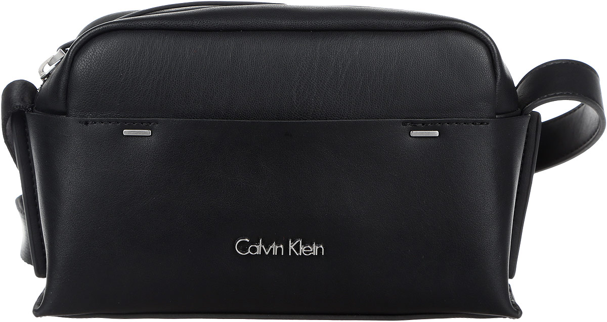 Сумка женская Calvin Klein Jeans, цвет: черный. K60K602424_9100K60K602424_9100 Сумка женская Calvin Klein Jeans, цвет: черный. K60K602424_9100K60K602424_9100Стильная и компактная женская сумка Calvin Klein Jeans выполнена из полиуретана и текстиля. Изделие имеет одно отделение, закрывающееся на застежку-молнию. Внутри находится накладной открытый карман. Снаружи, на передней стенке расположен нашивной открытый карман. Сумка оснащена регулируемым плечевым ремнем. Основание изделия защищено от повреждений металлическими ножками. Стильная сумка идеально подчеркнет ваш неповторимый стиль.