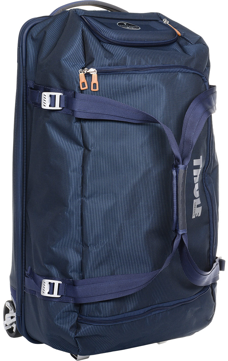 Сумка багажная Thule Crossover Rolling Duffel, на колесах, цвет: темно-синий, 87 л3201095 Сумка багажная Thule Crossover Rolling Duffel, на колесах, цвет: темно-синий, 87 л3201095Дорожная сумка на колесах Thule Crossover Rolling Duffel - вместительная сумка с широким входом, куда можно с легкостью положить шлем, ботинки, перчатки, куртку и другие туристические принадлежности. Алюминиевый каркас и водостойкий материал делают эту сумку легкой, но прочной. Надежный экзоскелет и задняя обшивка из полипропилена обеспечат надежную защиту во время путешествий в самых сложных условиях. Крепкие колеса увеличенного размера и телескопическая ручка с технологией Thule V-Tubing гарантирует мягкое, плавное и ровное движение в течение многих лет. Имеются регулировочные ремни для подгонки размера сумки в зависимости от количества багажа. Изготовленное по технологии горячей прессовки ударопрочное отделение SafeZone защитит ваши очки, портативную электронику и другие хрупкие вещи (отделение запирается и может быть удалено для освобождения дополнительного места). Главное отделение с потайным отсеком поможет ...