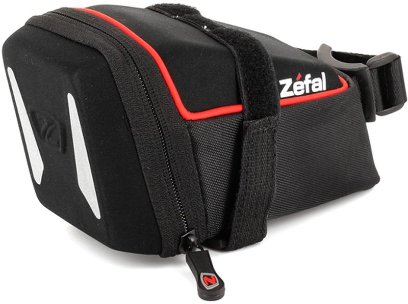 Велосумка под седло Zefal Iron Pack L-DS, 13 х 6 х 6 см7031 Велосумка под седло Zefal Iron Pack L-DS, 13 х 6 х 6 см7031ZEFAL Iron Pack L-DS незаметно размещается под седлом, надёжно закрепляясь за рамки седла и подседельный штырь ремешками с двойной липучкой велкро. Износостойкий материал сумки 840 D2 EVA и молнии с влагозащитой не пропускают внутрь воду и пыль, вы можете смело перевозить в ней телефон, ключи и документы. Для Вашей большей безопасности, на сумку нанесены светоотражающие элементы. ZEFAL – старейший французский производитель велосипедных аксессуаров премиального качества, основанный в 1880 году, является номером один на французском рынке велосипедных аксессуаров. • Крепление за рамки седла и подседельный штырь • Вес 110 г. • Размер 160 х 85 х 90 мм. • Объём 0,8 л. • Материал сумки 840 D2 EVA • Молнии с влагозащитой • Светоотражающие элементы