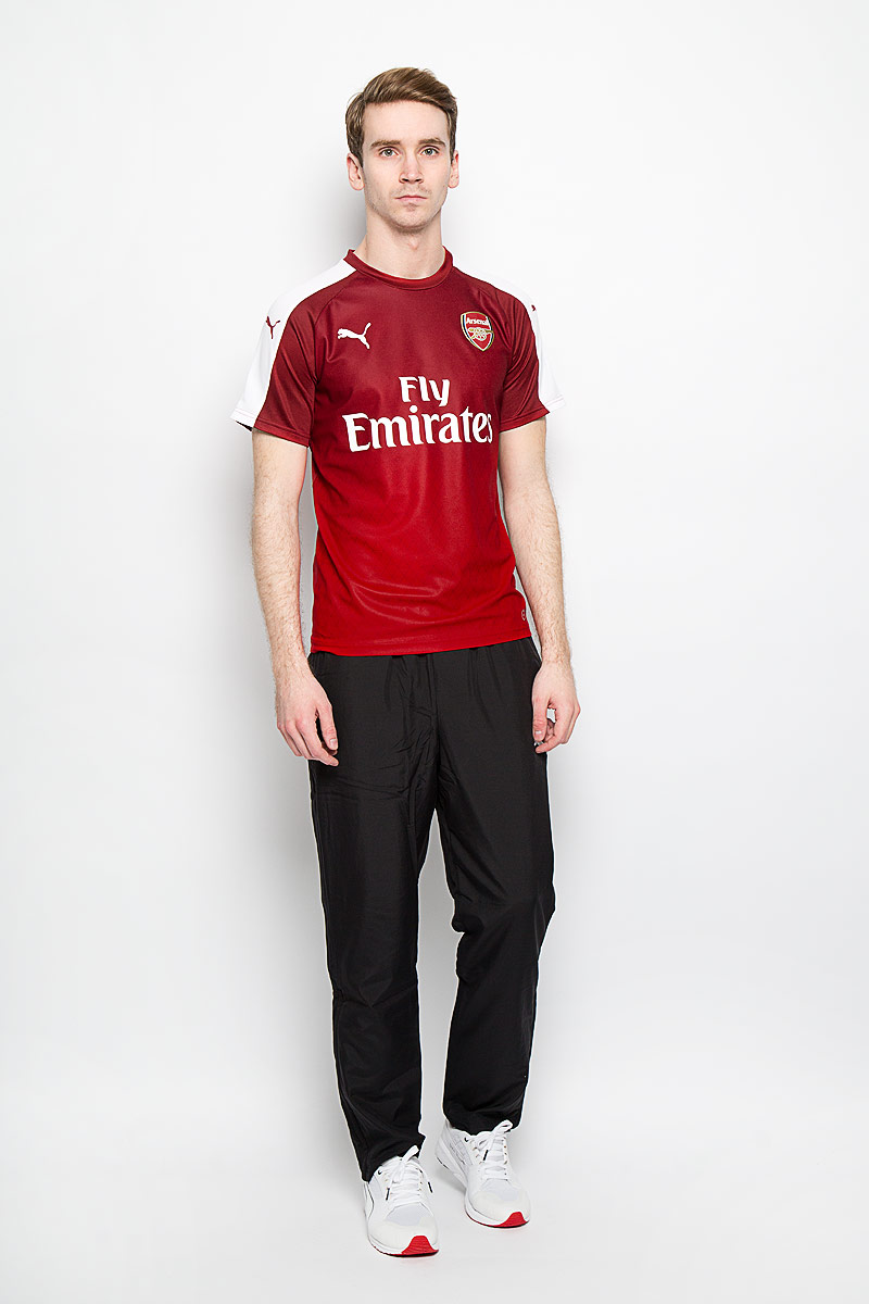 Футболка мужская Arsenal Stadium Tee. 7491430749143011 Футболка мужская Arsenal Stadium Tee. 7491430749143011Стильная мужская футболка Puma Arsenal Stadium Tee, выполненная из высококачественного материала, превосходно подойдет для занятий спортом, бега и активного отдыха. Модель с короткими рукавами-реглан и круглым вырезом горловины декорирована эмблемой ФК Арсенал из полиуретановой ткани, треугольным логотипом клуба, лозунгом канониров и фирменной символикой PUMA, нанесенной методом термопечати. Эта линия одежды - олицетворение страсти поклонников, влюбленных в успех и традиции футбола.