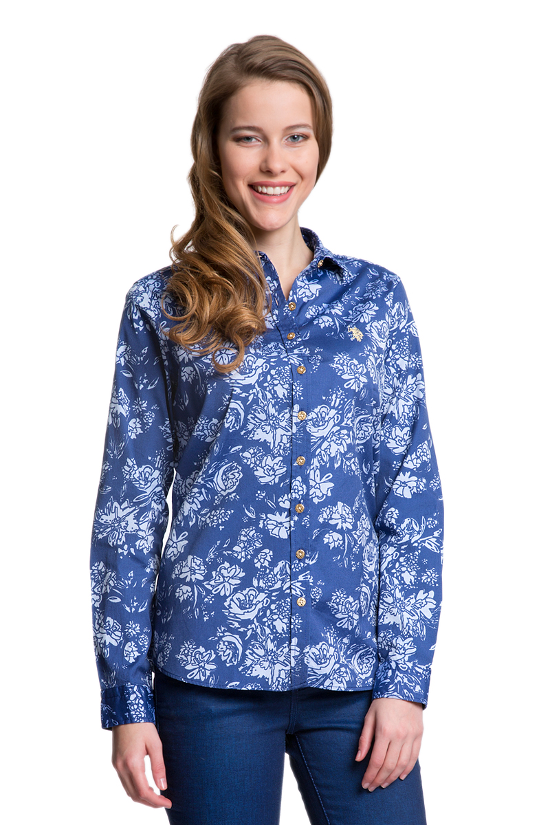РубашкаG082SZ004HELGAFLOX_VR013 РубашкаG082SZ004HELGAFLOX_VR013Женская рубашка U.S. Polo Assn. выполнена из натурального хлопка. Модель с отложным воротником и длинными рукавами застегивается спереди на пуговицы по всей длине. На манжетах предусмотрены застежки-пуговицы. Рубашка украшена вышитым логотипом бренда.