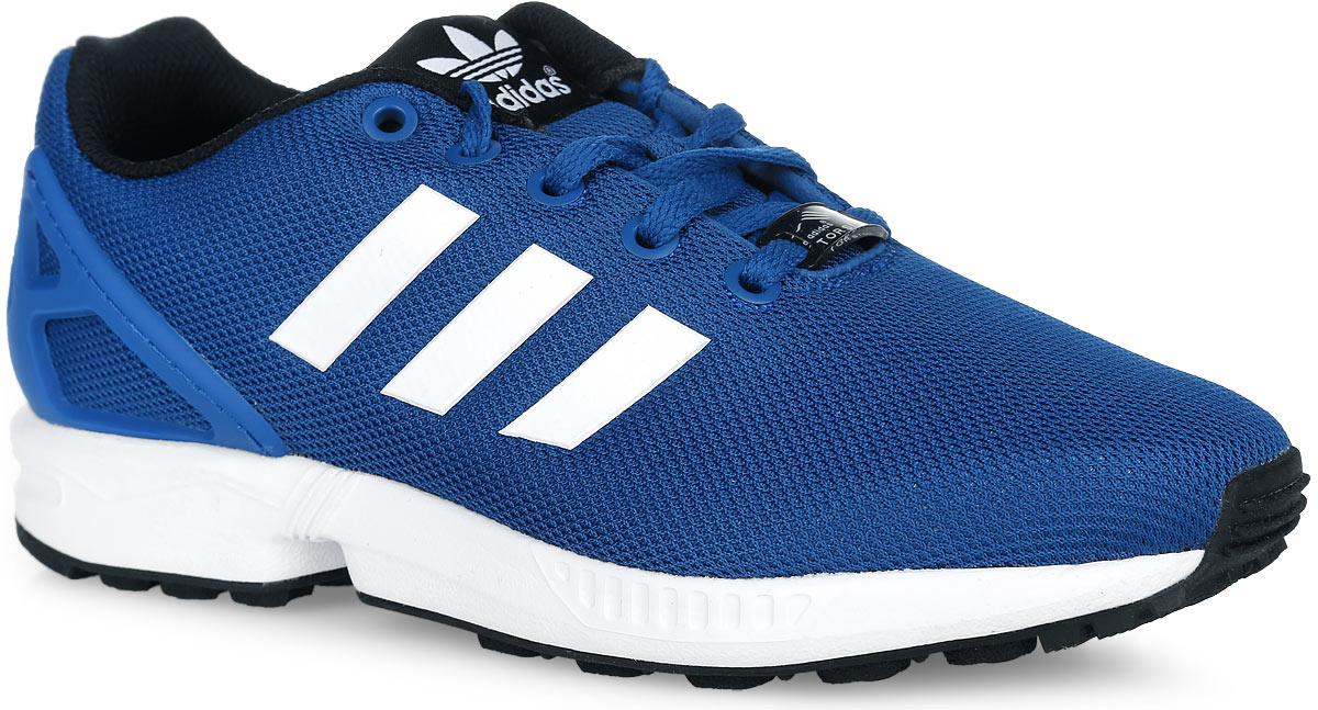 КроссовкиS74955 КроссовкиS74955Модные детские кроссовки ZX Flux от adidas Originals придутся по душе вашему ребенку. Модель выполнена из текстиля и оформлена по бокам бесшовными полосками, на язычке - фирменной нашивкой. Пяточная часть защищена вставкой из полимера. Классическая шнуровка обеспечивает надежную фиксацию модели на ноге. Внутренняя поверхность из текстиля не натирает. Амортизирующая дышащая стелька EcoOrthoLite из экологически чистых материалов, благодаря специальному составу, препятствует распространению бактерий, вызывающих запах. Технология подошвы Torsion System обеспечивает поддержку средней части стопы. Промежуточная подошва из материала ЭВА обеспечивает отличную амортизацию. Рифление на подошве гарантирует сцепление с любой поверхностью. Стильные и удобные кроссовки - необходимая вещь в гардеробе каждого ребенка!