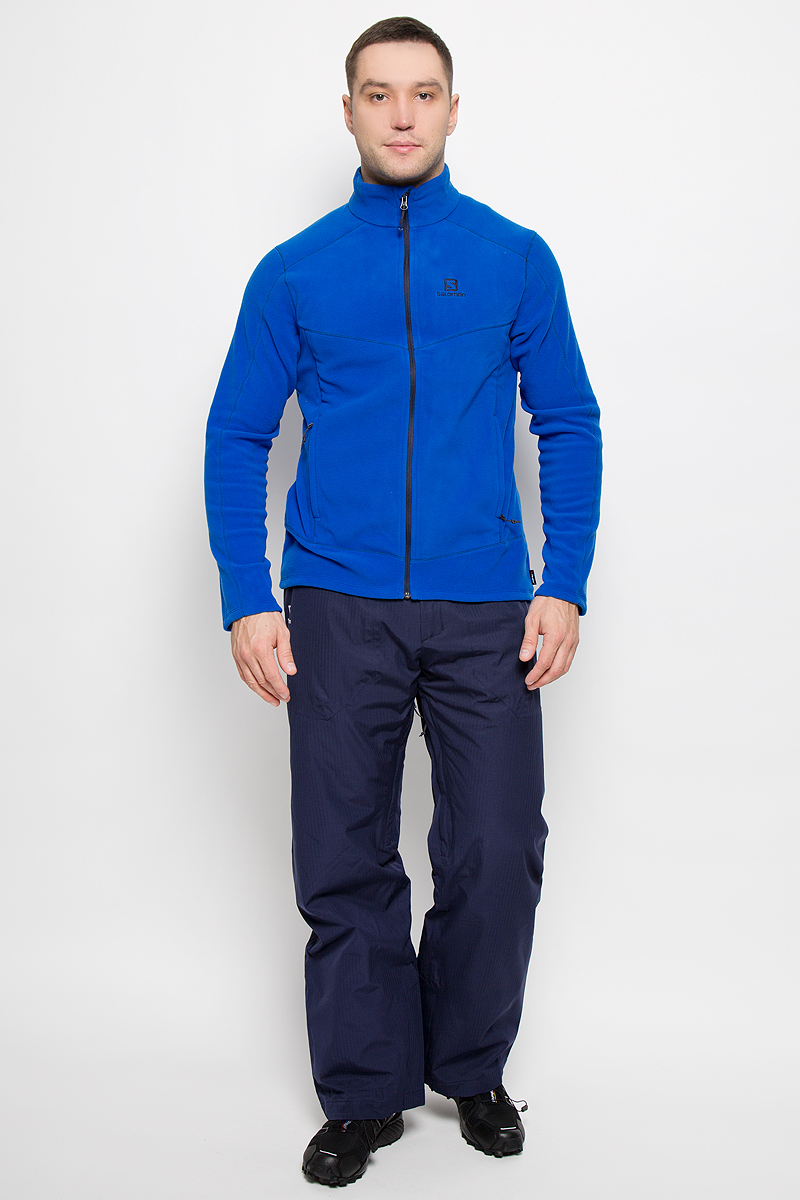 ОлимпийкаL39205700 ОлимпийкаL39205700Мужская олимпийка Salomon Contour Fz с длинными рукавами и воротником-стойкой выполнена из мягкого микрофлиса Polarteс, который согреет вас в любую погоду. Модель застегивается на застежку-молнию, оснащена двумя втачными карманами на застежках-молниях спереди.