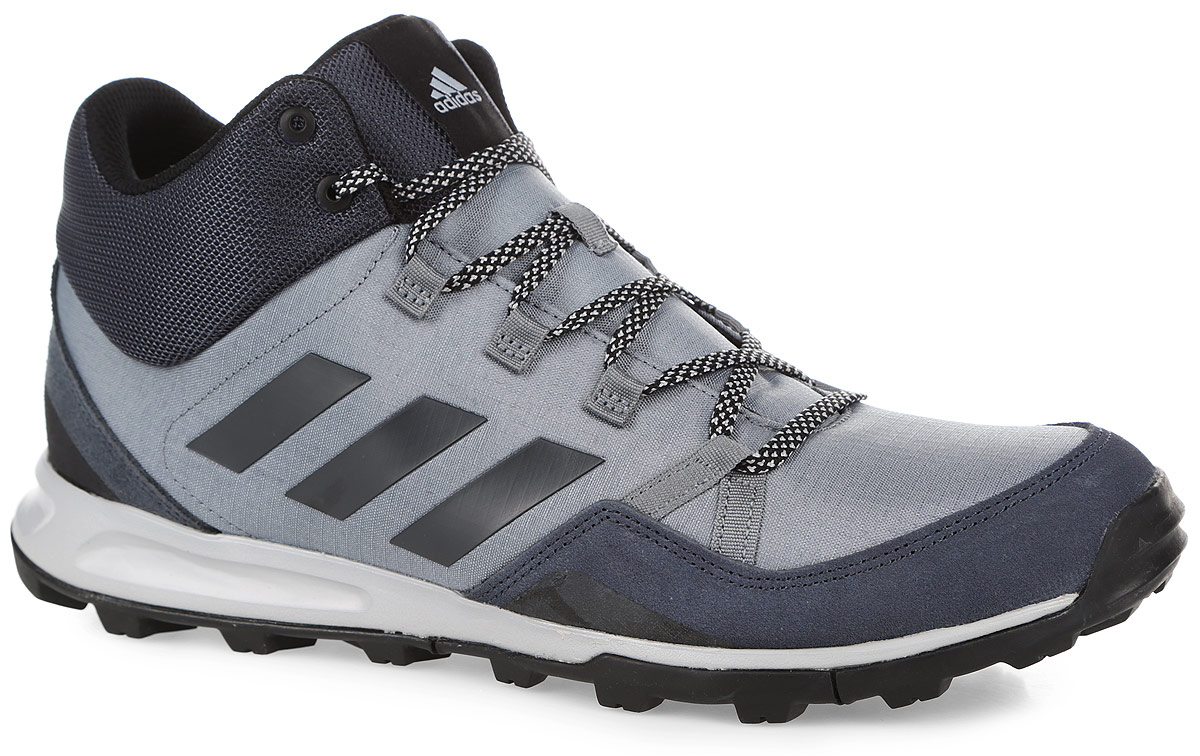 КроссовкиAQ2578 КроссовкиAQ2578Легкие мужские кроссовки средней высоты Tivid Mid от adidas одинаково хороши как для несложных пеших походов, так и для прогулок по городу. Модель с прочным верхом из рипстопа дополнена замшевыми вставками. По бокам модель оформлена фирменными тремя полосками. Легкая упругая промежуточная подошва из ЭВА сохраняет свои свойства в течение длительного времени. Резиновая подошва Traxion и специальный глубокий протектор адаптированы для максимального сцепления даже с мокрыми поверхностями. Классическая шнуровка надежно зафиксирует модель на ноге.