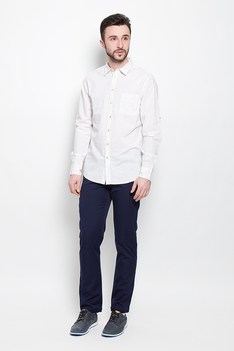 РубашкаH-212/743-7111 РубашкаH-212/743-7111Мужская рубашка Sela Casual Wear выполнена из натурального хлопка. Рубашка с длинными рукавами и отложным воротником застегивается на пуговицы спереди. Манжеты рукавов также застегиваются на пуговицы. Рукава дополнены хлястиками на пуговицах, позволяющими зафиксировать их в закатанном состоянии. На груди расположен накладной карман.