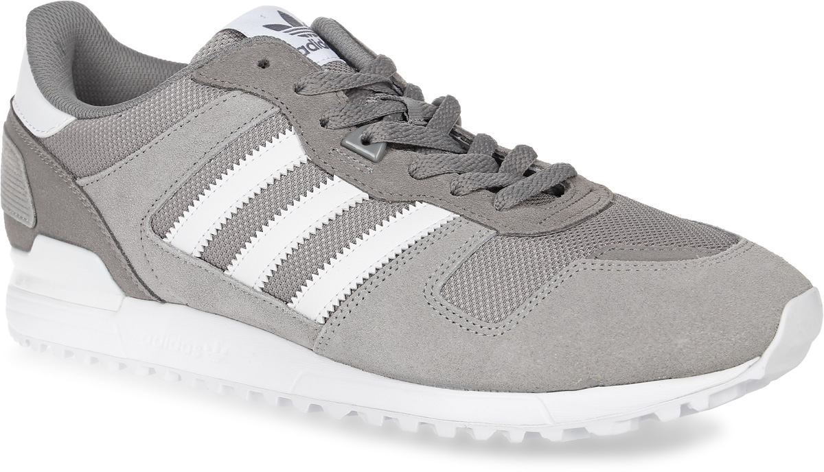 КроссовкиBB1212 КроссовкиBB1212Мужские кроссовки adidas Originals Zx 700 выполнены из натуральной замши, текстиля и искусственной кожи. Модель оформлена фирменными нашивками. Шнурки надежно зафиксируют модель на ноге. Внутренняя поверхность из сетчатого текстиля комфортна при движении. Стелька выполнена из легкого ЭВА-материала с поверхностью из текстиля. Подошва изготовлена из высококачественной резины и дополнена рельефным рисунком.