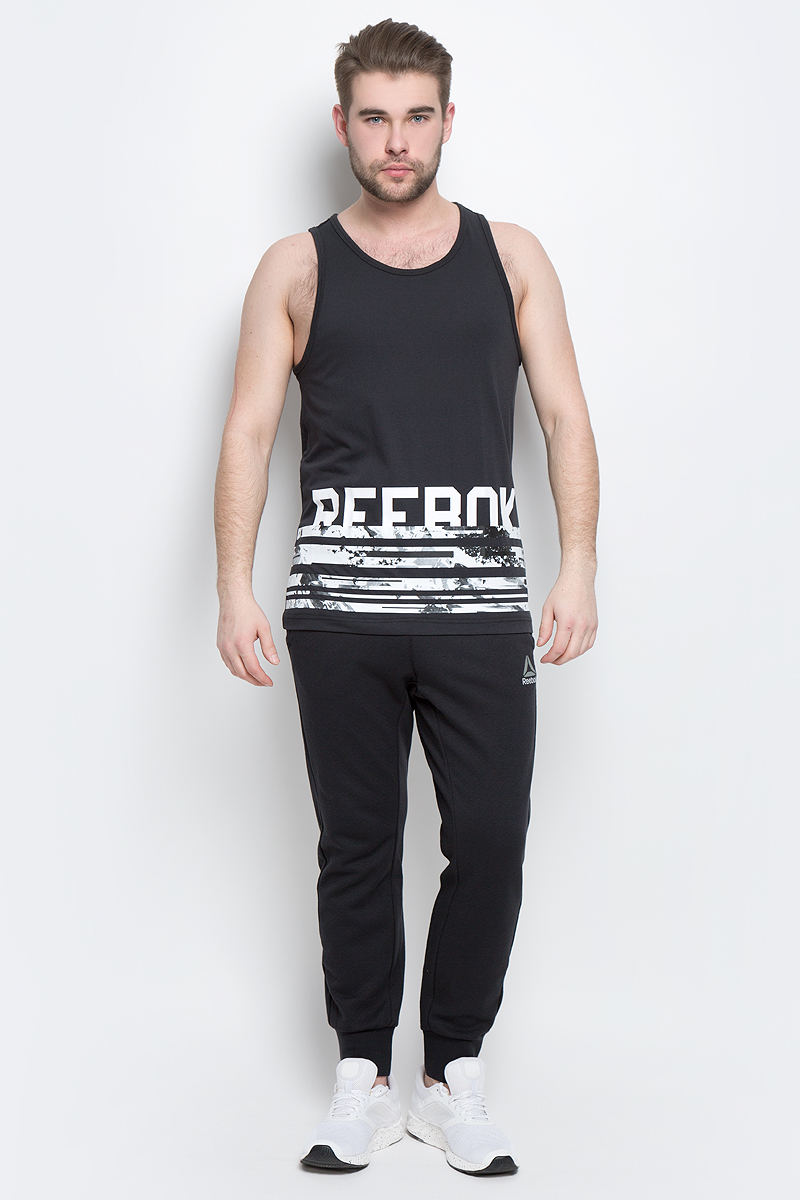 МайкаBK4700 МайкаBK4700Стильная мужская майка Reebok Wor C Tank изготовлена из натурального хлопка с добавлением полиэстера. Широкий круглый ворот не стесняет движения во время занятий спортом. Передняя часть декорирована принтом с названием бренда. Текстильное полотно на спинке модели выполнено оригинальной вязкой с рисунком.