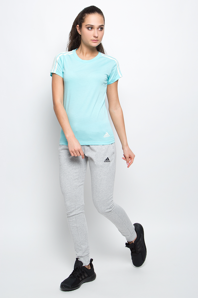 ФутболкаS97184 ФутболкаS97184Спортивная женская футболка Ess 3s slim tee от adidas современного приталенного кроя выполнена из отводящей влагу ткани с технологией climalite, которая поможет сохранить комфортное ощущение сухости. У модели круглый ворот, на рукавах узнаваемые три полоски. Эта модель - часть экологической программы adidas: использованы технологии, сберегающие природные ресурсы, каждая нить имеет значение, переработанный полиэстер сохраняет природные ресурсы и уменьшает отходы производства.
