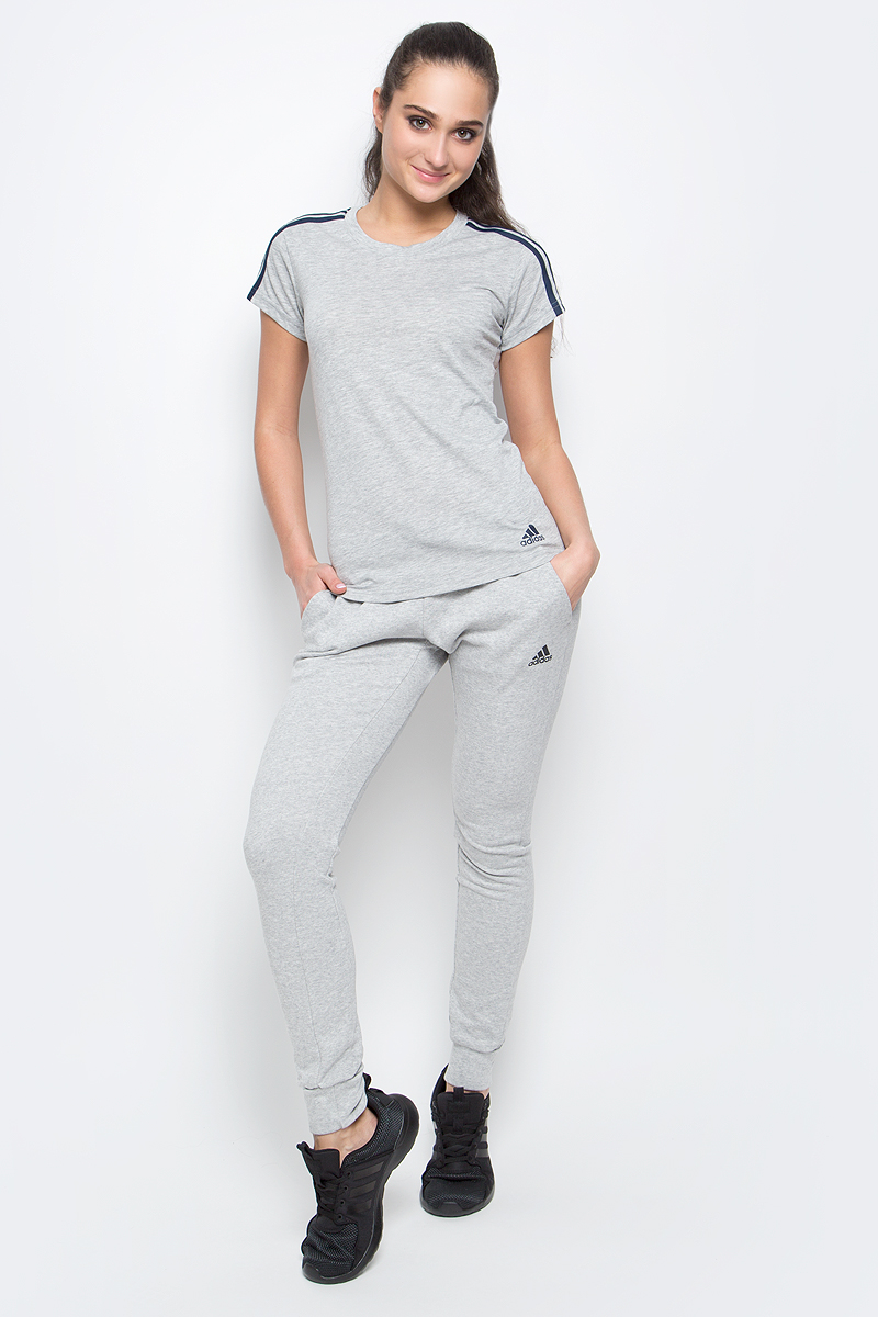 ФутболкаS97184 ФутболкаS97184Спортивная женская футболка Ess 3s slim tee от adidas современного приталенного кроя выполнена из отводящей влагу ткани с технологией climalite, которая поможет сохранить комфортное ощущение сухости. У модели круглый ворот, на рукавах узнаваемые три полоски. Эта модель - часть экологической программы adidas: использованы технологии, сберегающие природные ресурсы, каждая нить имеет значение, переработанный полиэстер сохраняет природные ресурсы и уменьшает отходы производства.