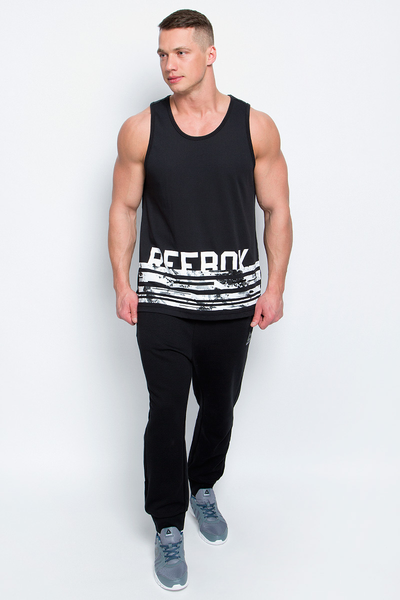 МайкаBK4700 МайкаBK4700Стильная мужская майка Reebok Wor C Tank изготовлена из натурального хлопка с добавлением полиэстера. Широкий круглый ворот не стесняет движений во время занятий спортом. Передняя часть декорирована принтом с названием бренда. Текстильное полотно на спинке модели выполнено оригинальной вязкой с рисунком.