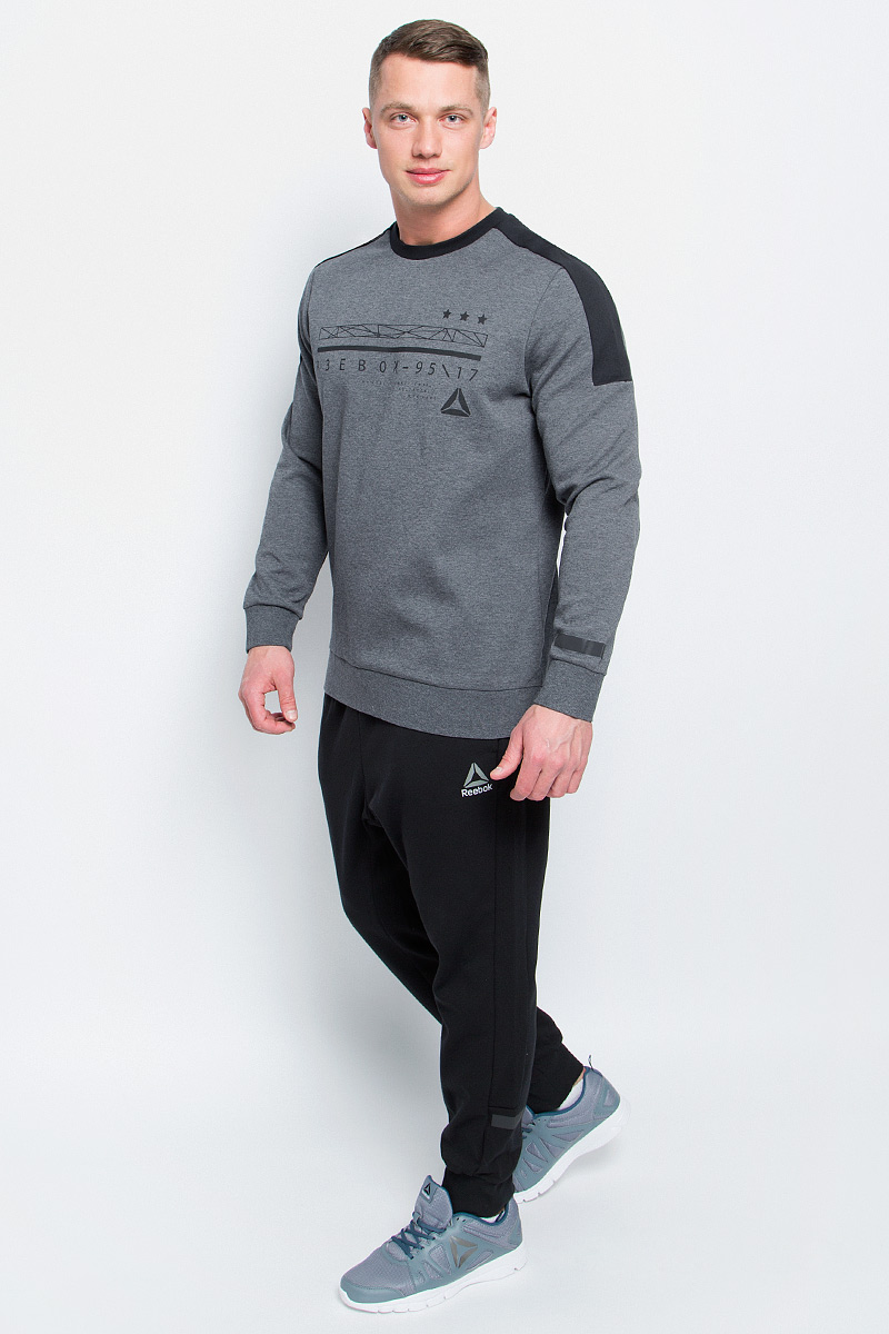 СвитшотBK4713 СвитшотBK4713Мужской свитшот Reebok Wor C Graphic Crew, выполненный из хлопка с добавлением полиэстера, идеально подойдет для повседневной носки и занятий спортом. Свитшот с круглым вырезом горловины и длинными рукавами оформлен оригинальным принтом с надписями. На рукавах предусмотрены широкие манжеты. Низ изделия дополнен трикотажной резинкой.