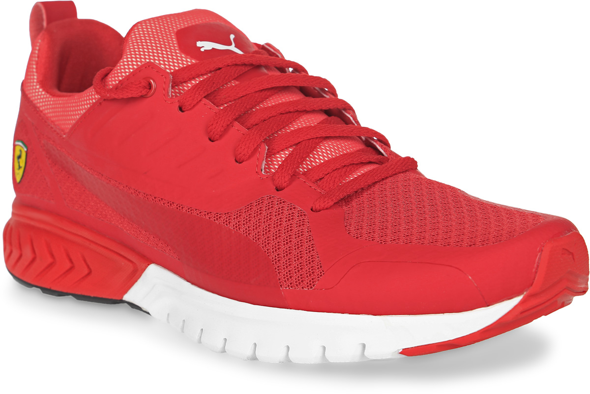 Кроссовки30590301 Кроссовки30590301Модель Puma Pitlane SF развивает традиции и стиль функциональной обуви легендарных автомехаников Формулы-1. Верх из специального сетчатого материала, промежуточная подошва с пенным материалом Faas Foam+, создающая дополнительную амортизацию, и наружная сторона подошвы из маслонепроницаемой резины делают эту модель особенно привлекательной для автолюбителя. Символика Ferrari широко представлена в данной модели, в том числе в виде логотипа гоночной команды Ferrari из термополиуретана сбоку, эмблемы Ferrari на союзке и тканого итальянского флага, пристроченного сбоку ближе к заднику.
