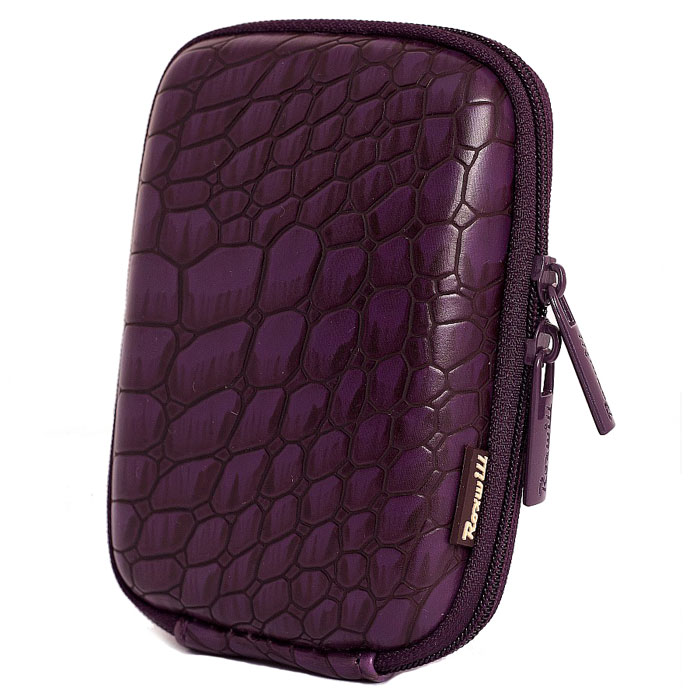 Roxwill C30 Croco, Violet чехол для фото- и видеокамерC30 croco violet Roxwill C30 Croco, Violet чехол для фото- и видеокамерC30 croco violetRoxwill C30 - стильный и надежный чехол для компактных фотокамер. Он гарантированно защитит вашу камеру от случайных ударов и царапин, а также от пыли и влаги. Изделие изготовлено из EVA (вспененная резина). Данный материал не подлежит воздействию агрессивных веществ и предохраняет фотоаппарат при падении. Для переноски предусмотрен регулируемый шейный ремешок и возможность крепления на поясном ремне.