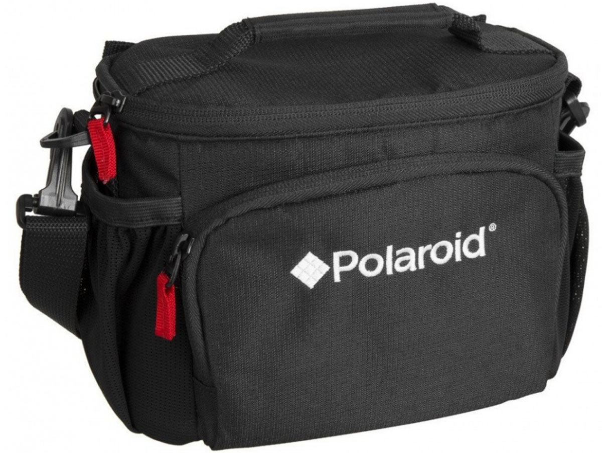Polaroid JOZ 36 Compact SLR Case сумка для фотокамерыPLJOZ36 Polaroid JOZ 36 Compact SLR Case сумка для фотокамерыPLJOZ36Сумка Polaroid JOZ 36 Compact SLR Case вмещает компактный фотоаппарат DSLR с объективом до 3.5 или беззеркальную камеру с объективом , дополнительный объектив, вспышку, аксессуары. Регулируемые мягкие делители обеспечивают защиту от ударов, а передний карман вмещает карты памяти, аккумуляторы и другие мелкие предметы. Боковые карманы из сетки идеально держат телефон или Ipod. Регулируемый, съемный плечевой ремень и ручка для переноски обеспечивает удобные варианты переноски.